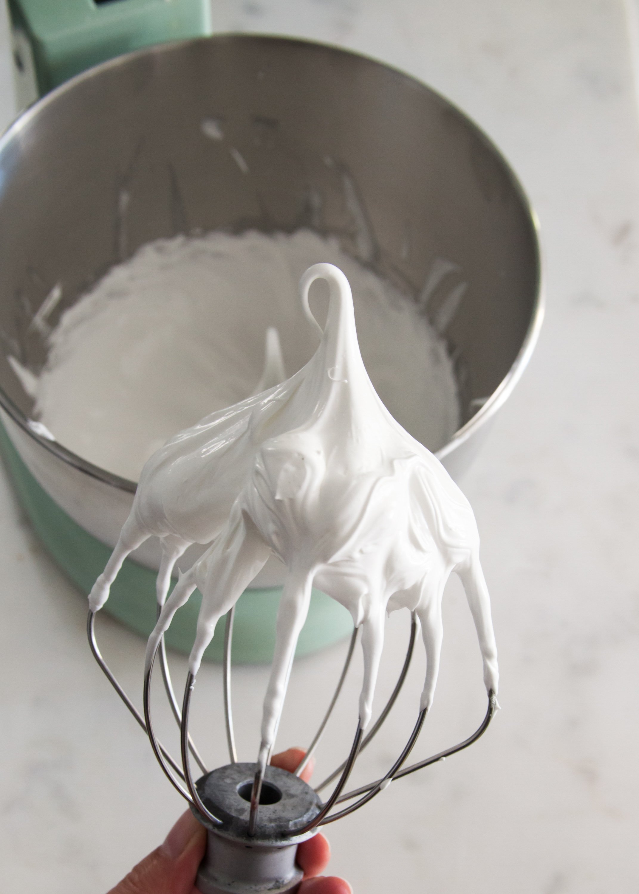 “In a separate large bowl, beat the egg whites and the remaining ½ teaspoon of salt with an electric hand mixer until soft peaks form. Gradually add the granulated sugar until fully incorporated. Continue to beat until stiff peaks form (you should be able to turn the bowl upside down without anything falling out).”的图片搜索结果