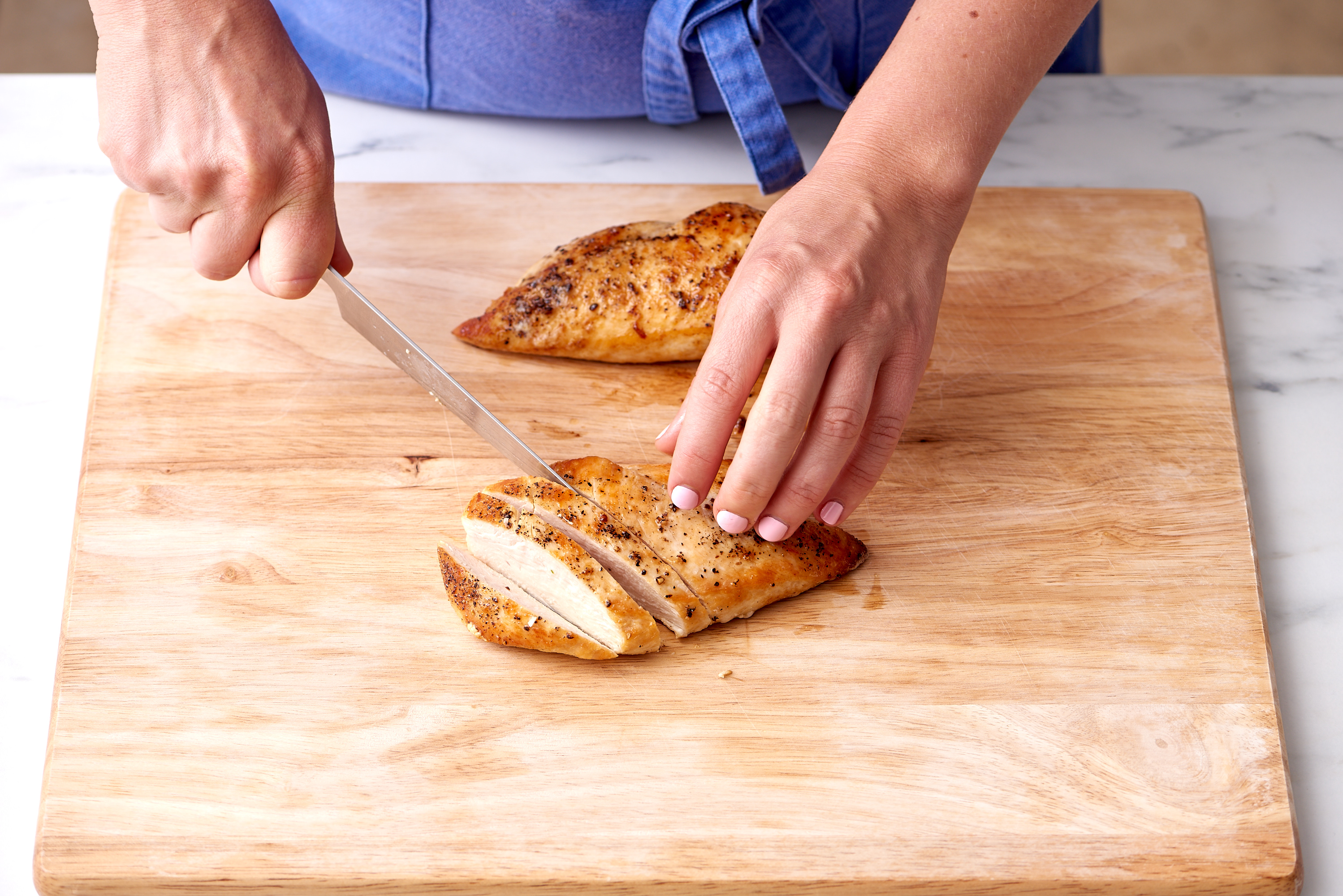 Here's Why You Should Have A Separate Cutting Board For Raw Chicken