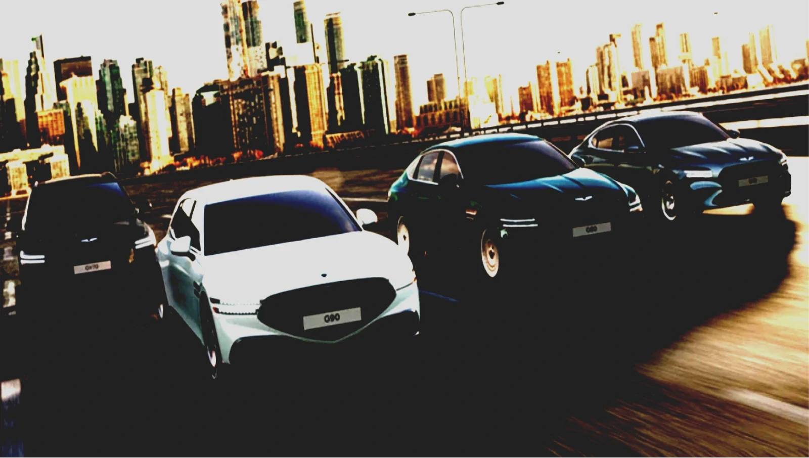 Genesis vehicles lineup on road with mountain backdrop