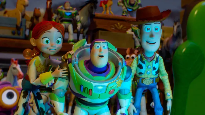 A still from Disney and Pixar's Toy Story 5 featuring the returning toy-box gang led by Woody and Buzz Lightyear