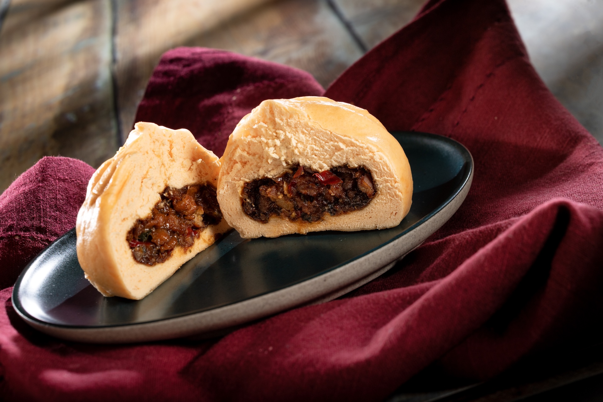 Teriyaki Chicken Bun, Steamed bun filled with minced chicken, vegetables, and teriyaki sauce, served at Japan during the 2026 EPCOT International Food and Wine Festival