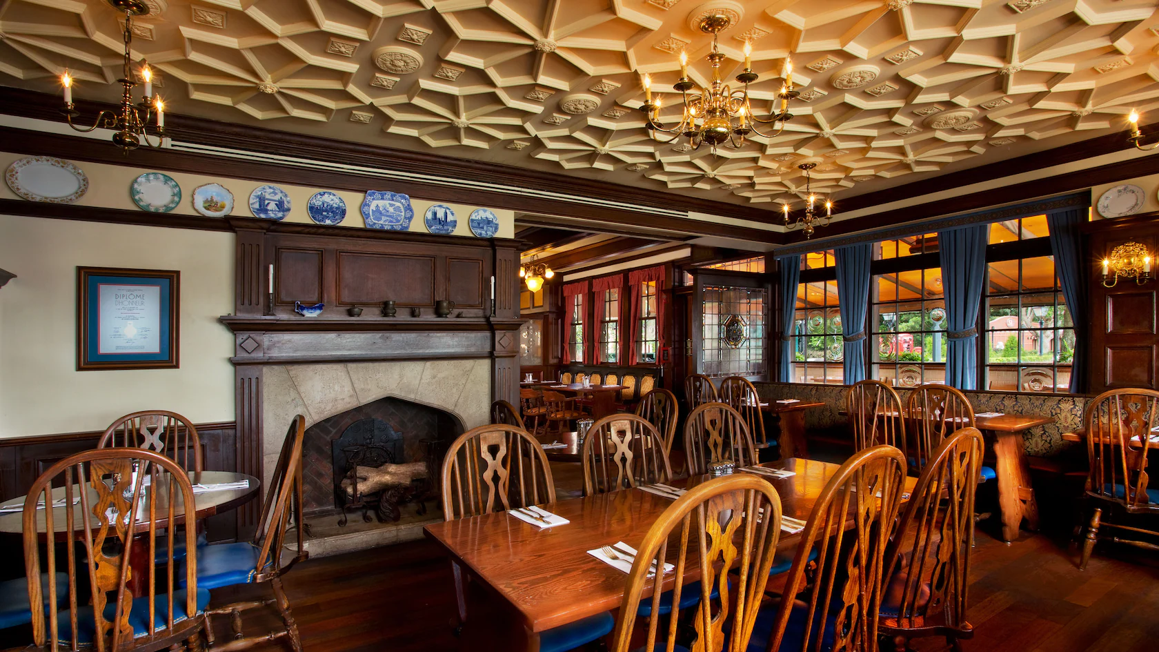 A Rose and Crown dining area with wood furnishings and a fireplace