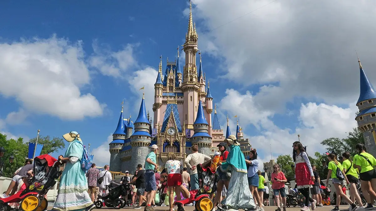 Guests walking toward Cinderella Castle on Main Street, U.S.A. at Magic Kingdom in Walt Disney World