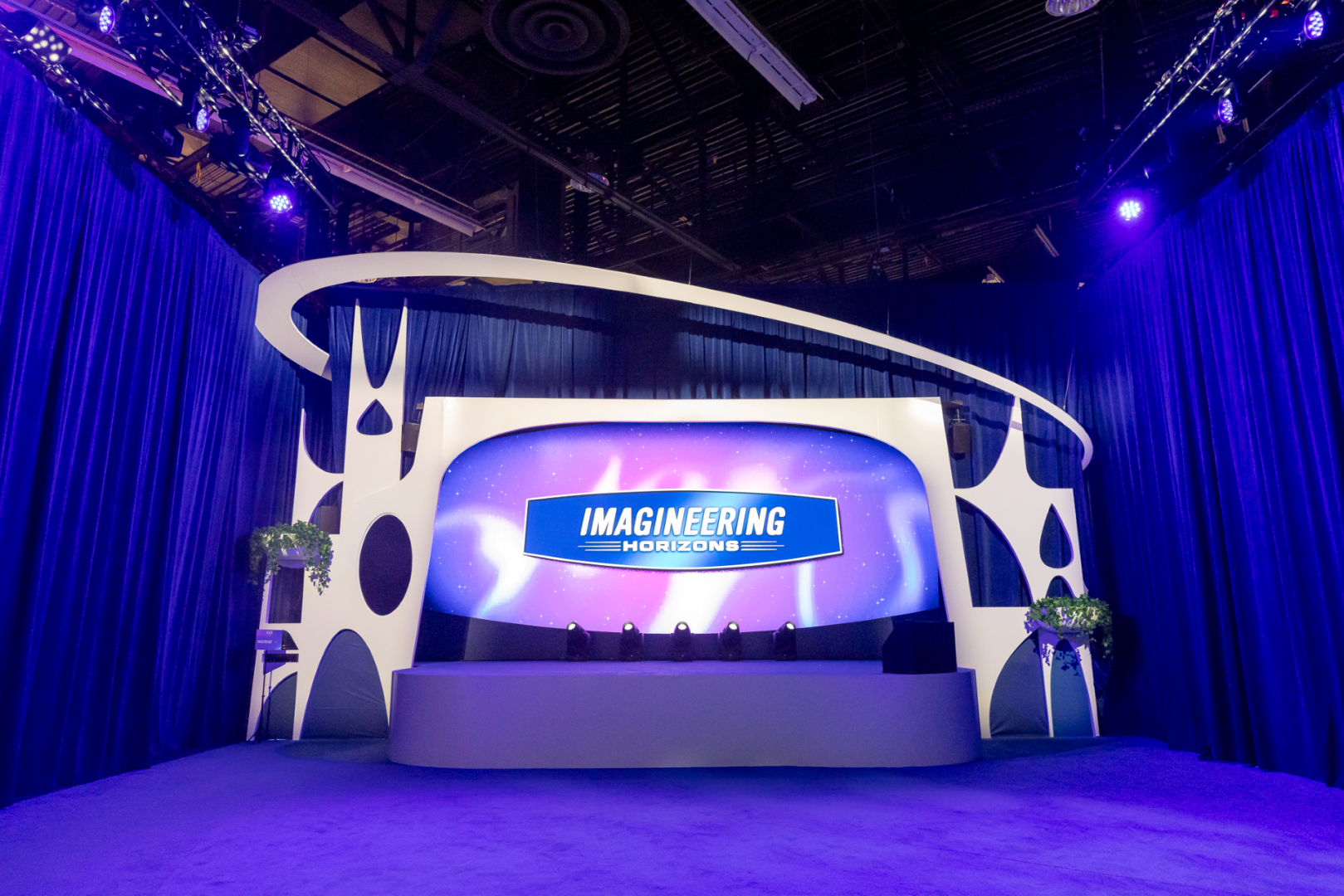 Exterior of the Imagineering Horizons pavilion at D23 2026 with its Progressland-inspired marquee