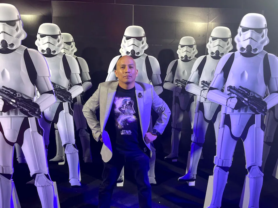 Disney Cast Member with Star Wars lightsaber