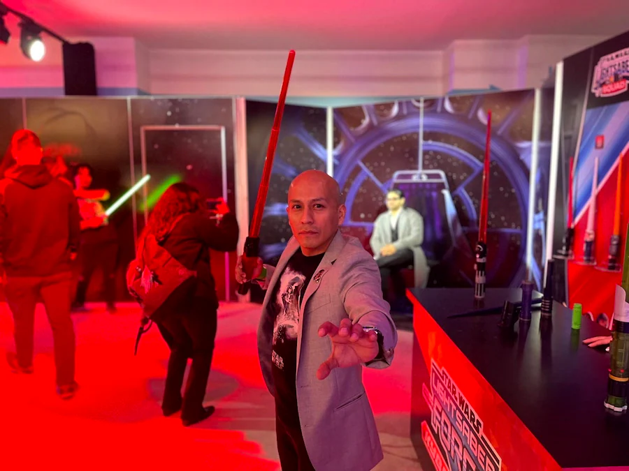 Disney Cast Member with Star Wars lightsaber