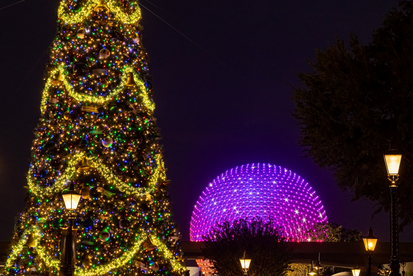 Spaceship Earth and a decorated Christmas tree during the EPCOT Festival of the Holidays