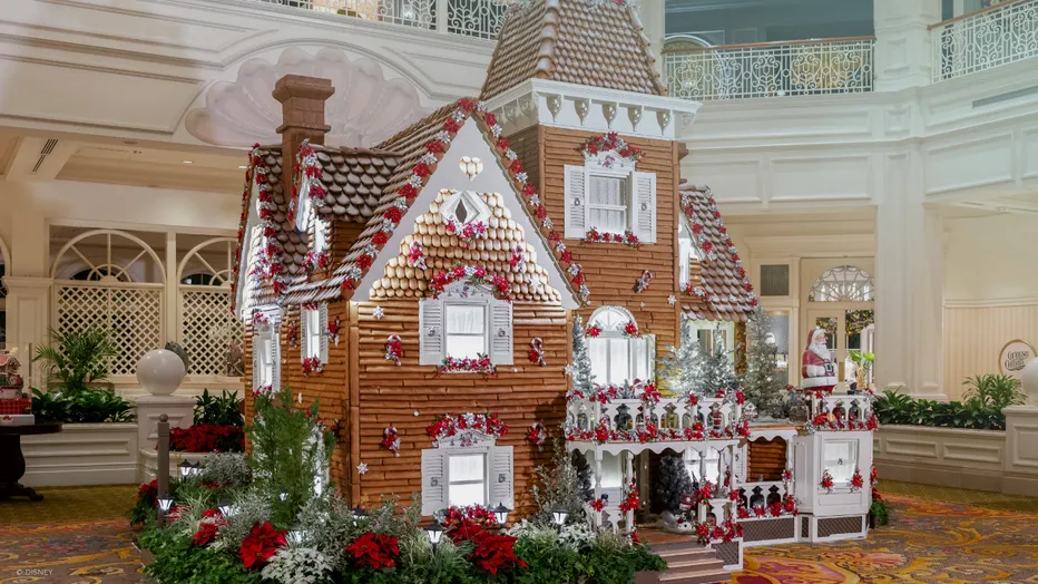 Giant gingerbread house holiday display in the Victorian lobby of Disney's Grand Floridian Resort and Spa at Walt Disney World