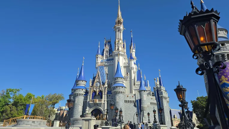 Cinderella Castle at Magic Kingdom under a clear blue sky