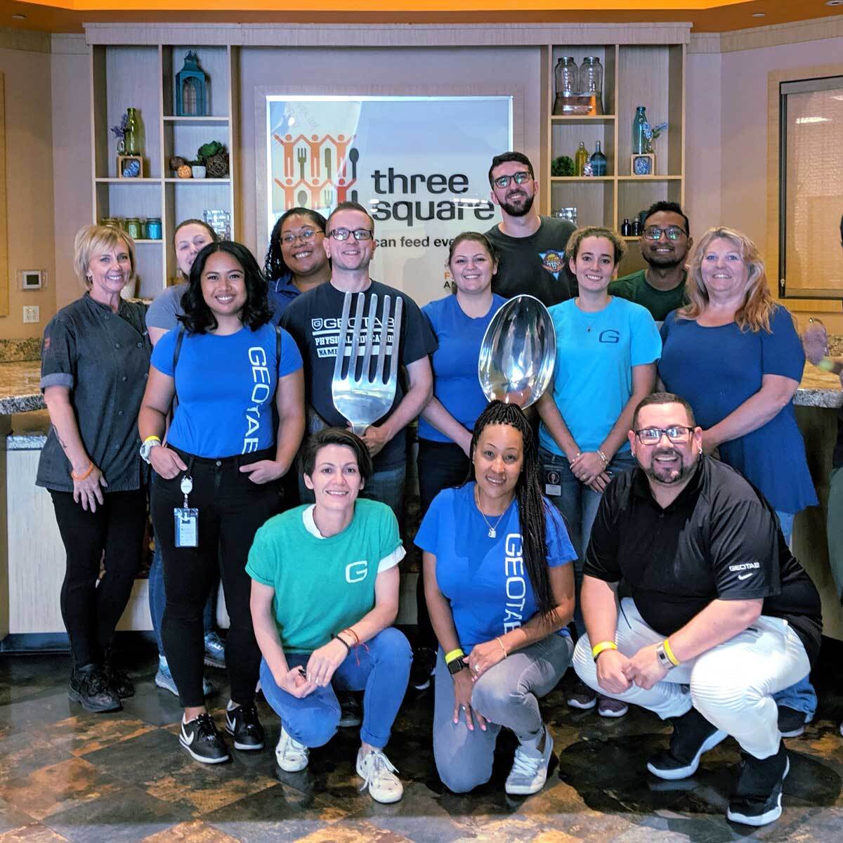 A group of Geotab employees posing for a photo