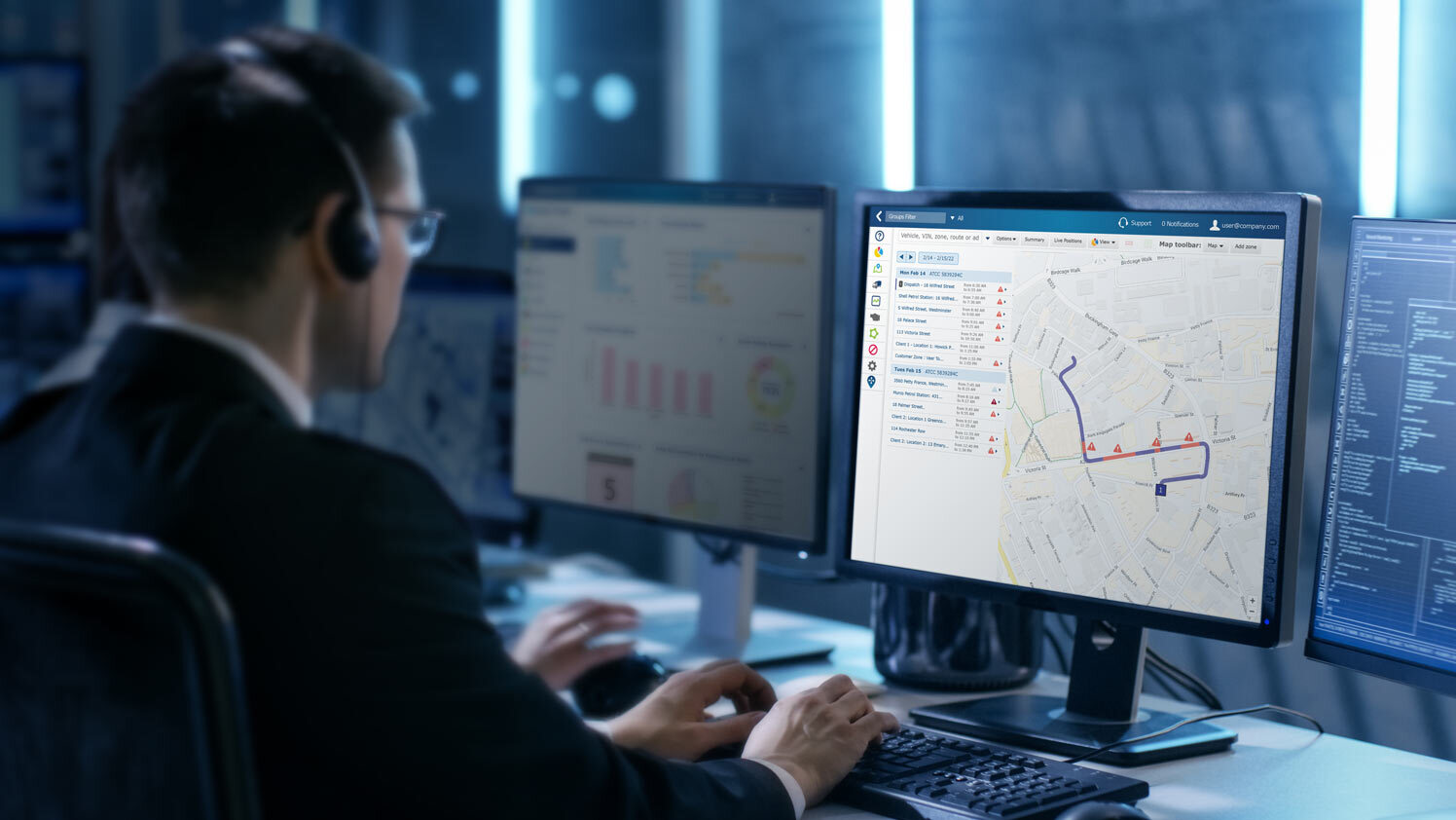Driver tracking in MyGeotab Man navigating MyGeotab dashboard on a computer monitor