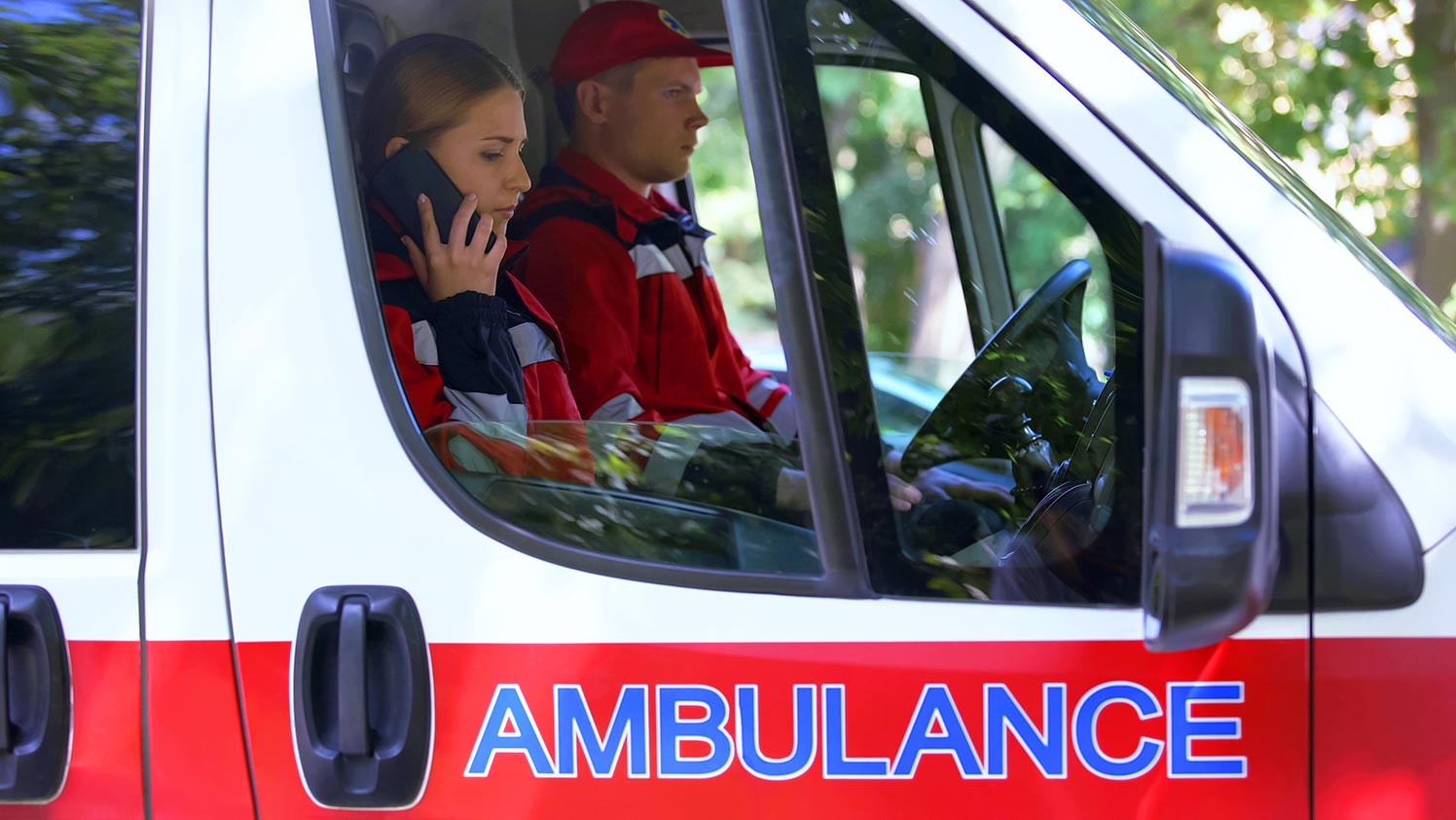 Two people sitting in an ambulance