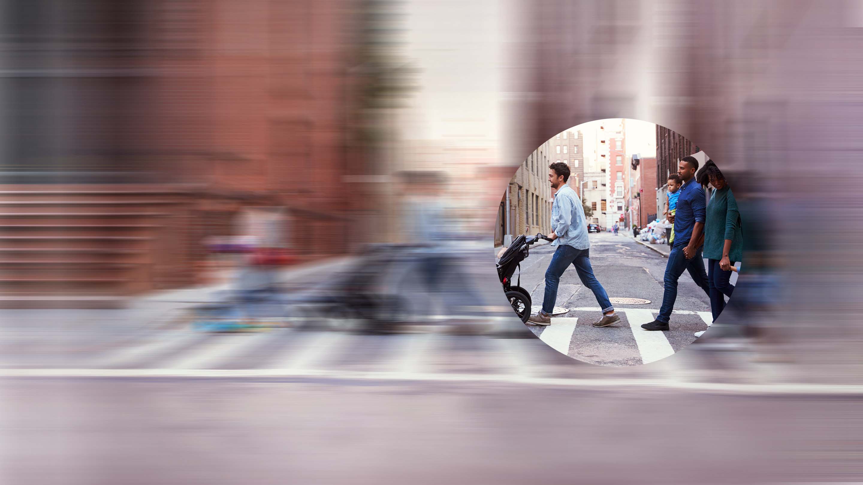 Picture in a circular frame of people crossing street 