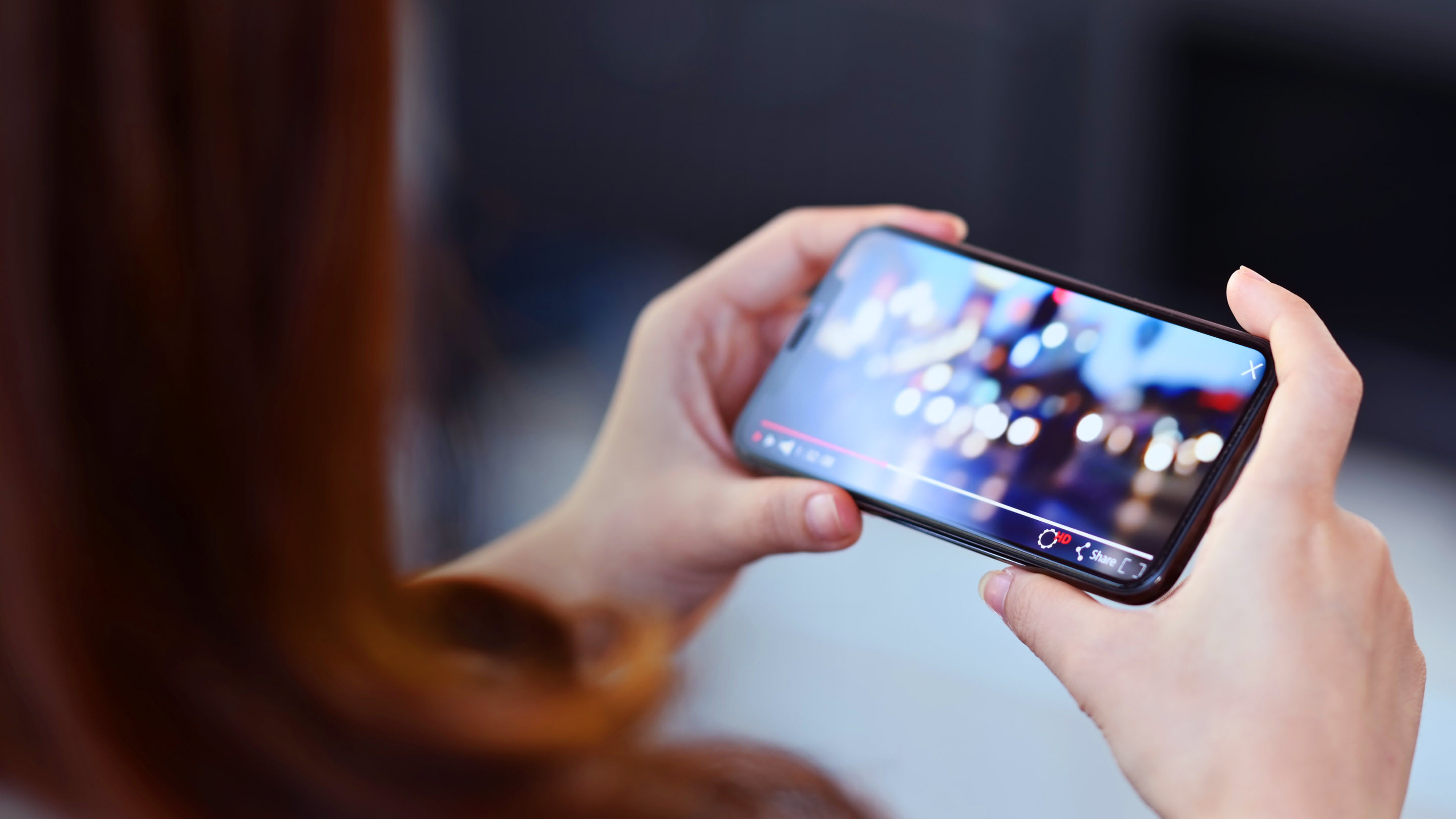 Person watching video on their phone