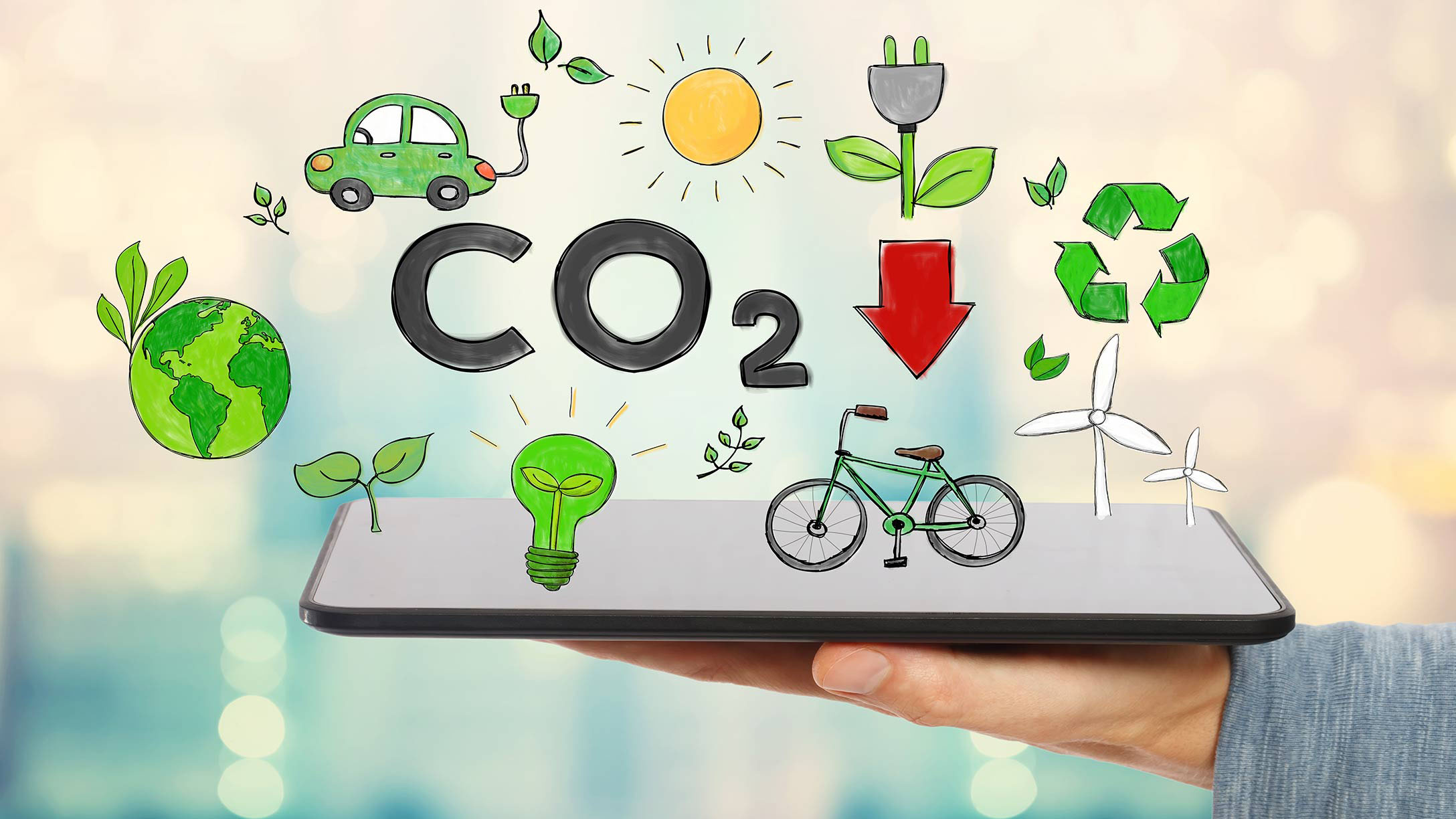 Tablet mit mehreren Symbolen wie CO2, Fahrrad, grüner Planet und mehr.