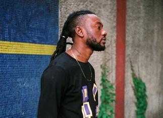 Disappointed Musician Turned Comedian Pappy Kojo French Kisses White Lady to Stop Rumours he's Gay