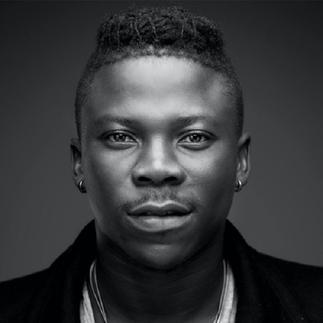 Tommy Hilfiger styles Stonebwoy for his record-breaking music video