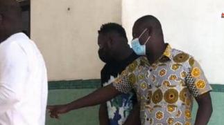 Medikal handcuffed to court