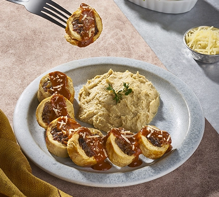 Rollo de pollo con cebolla caramelizada y adobo