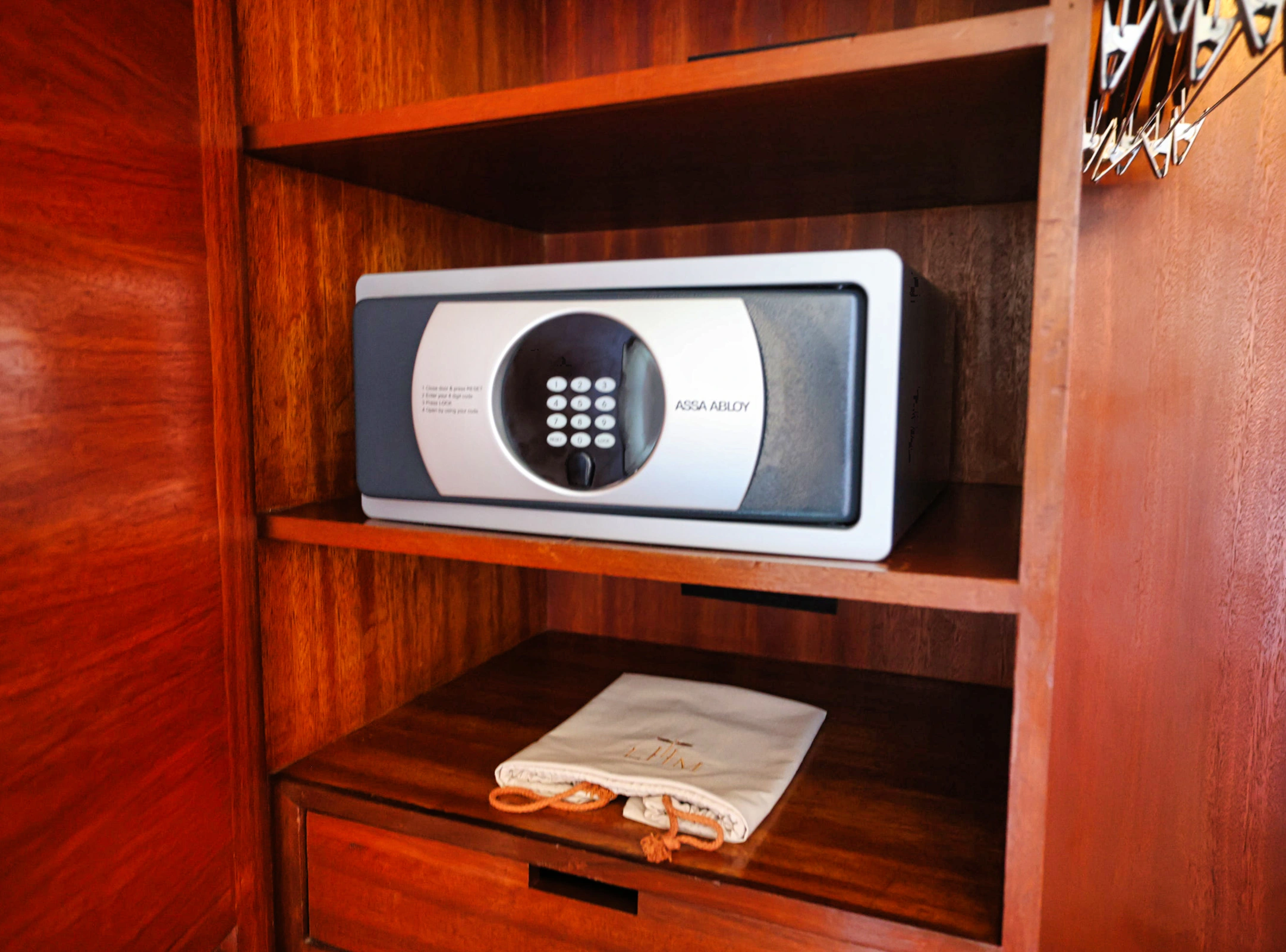 Hotel amenities including slippers and a safe box