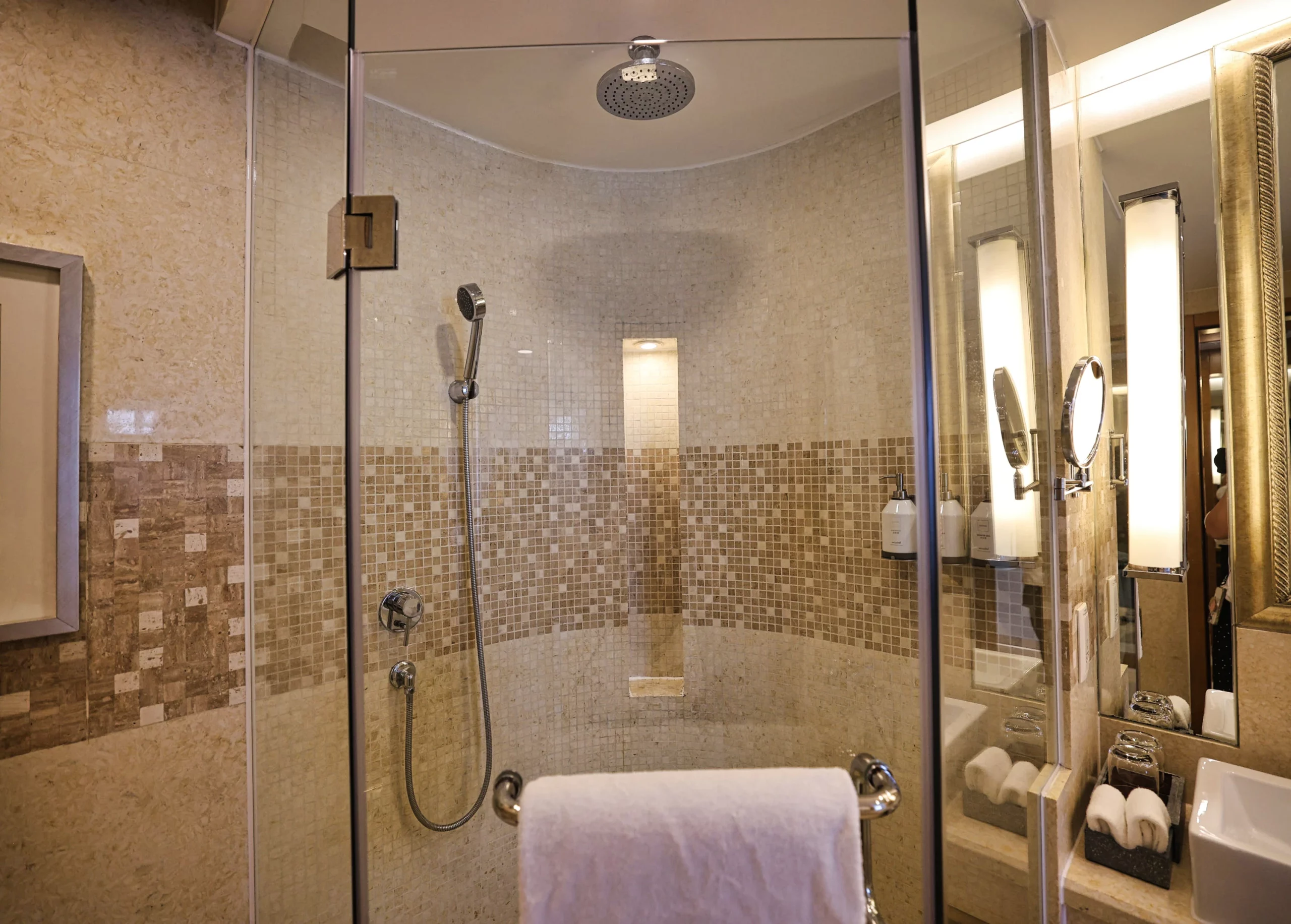Separate shower and bathtub in a hotel bathroom