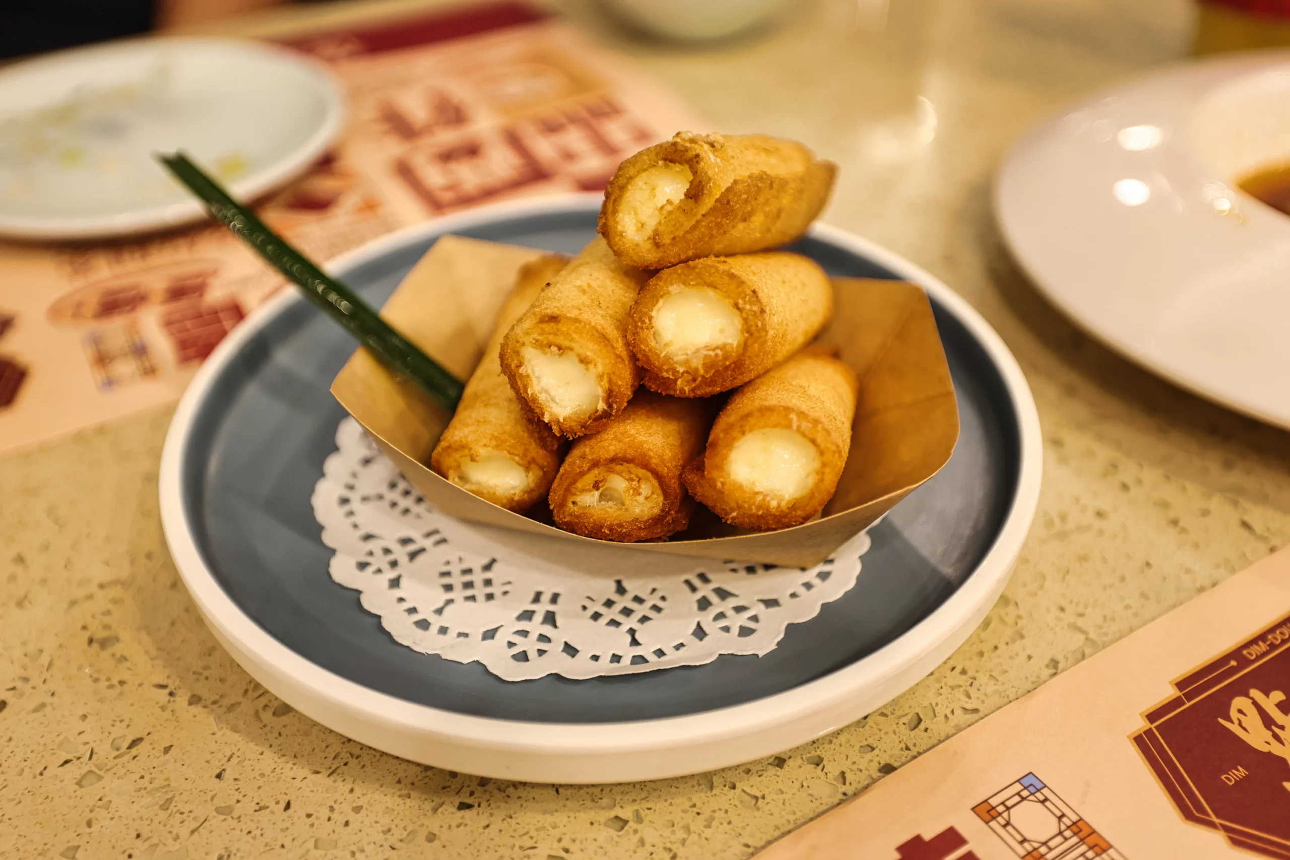 Crispy fried milk roll dessert presentation