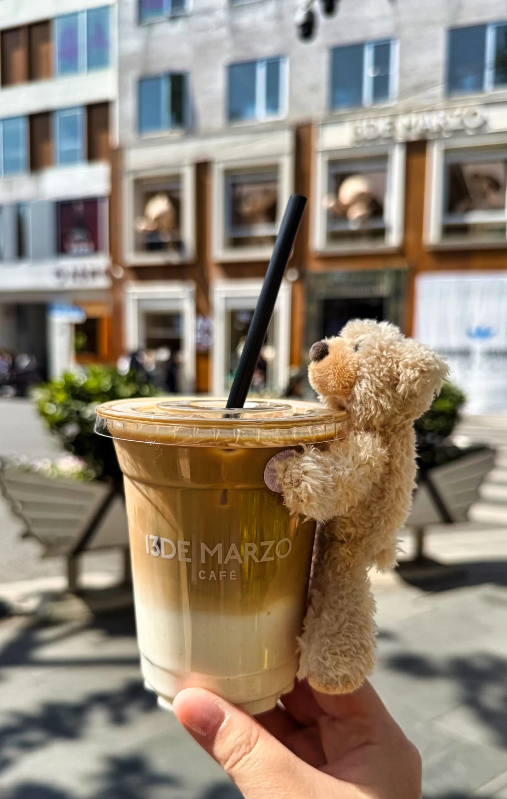 Close-up of the 13DE MARZO bear doll accessory