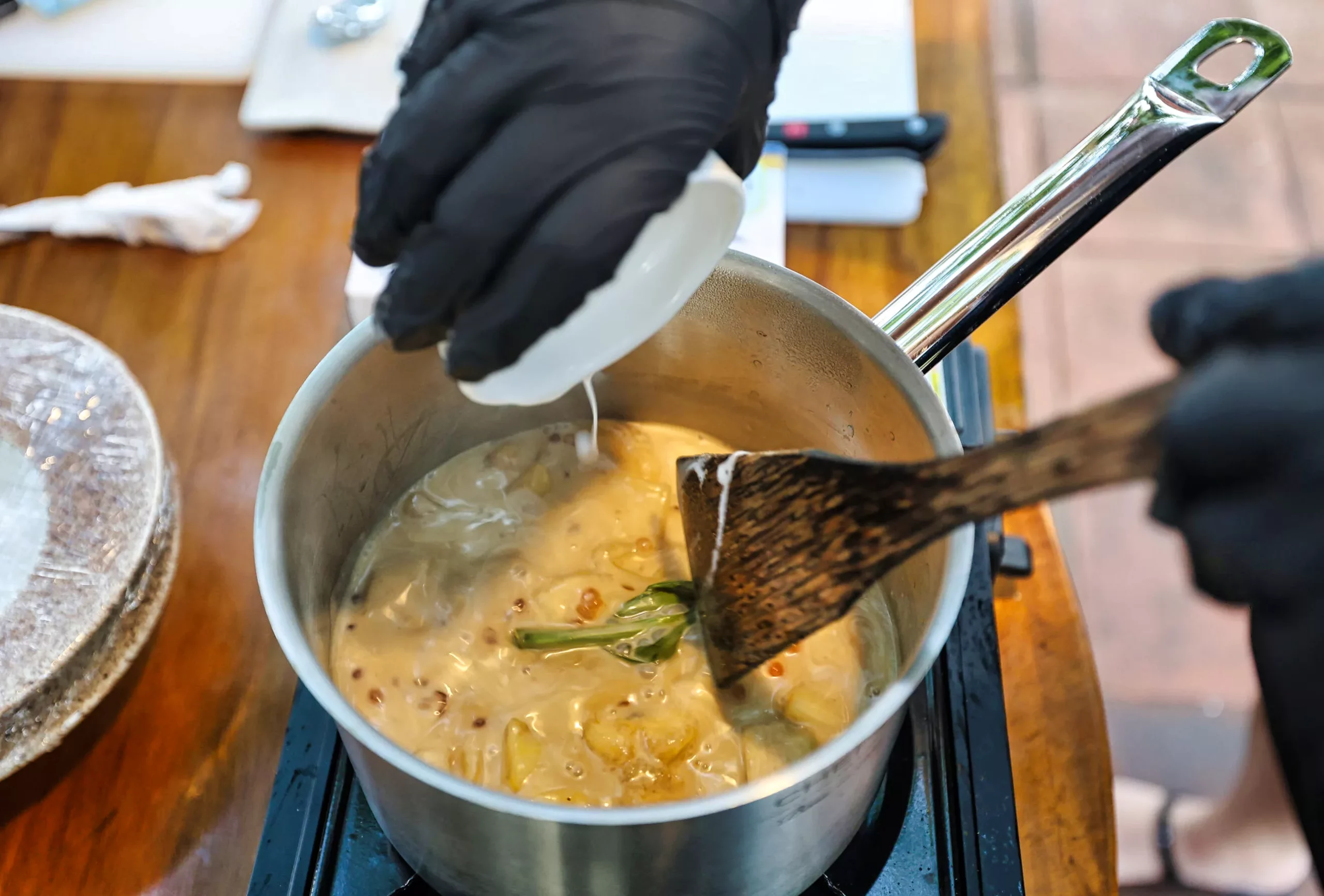 Making and tasting Kolak Pisang dessert