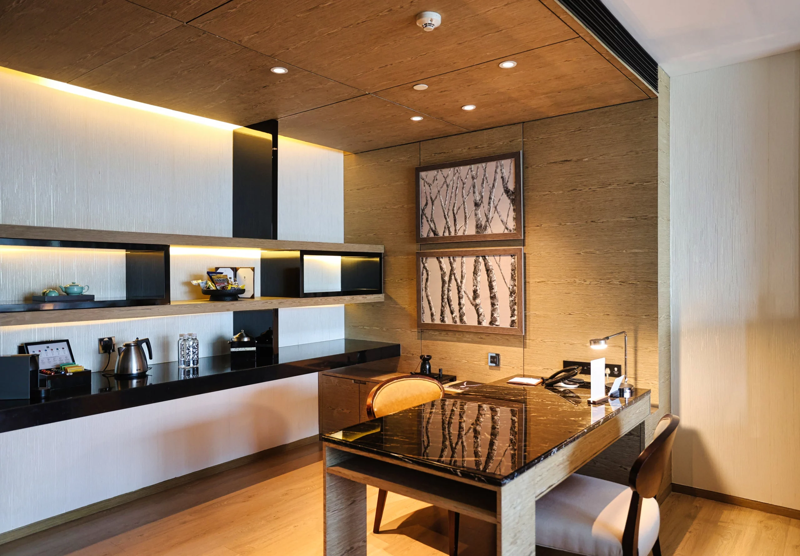 Desk area with various hotel amenities provided