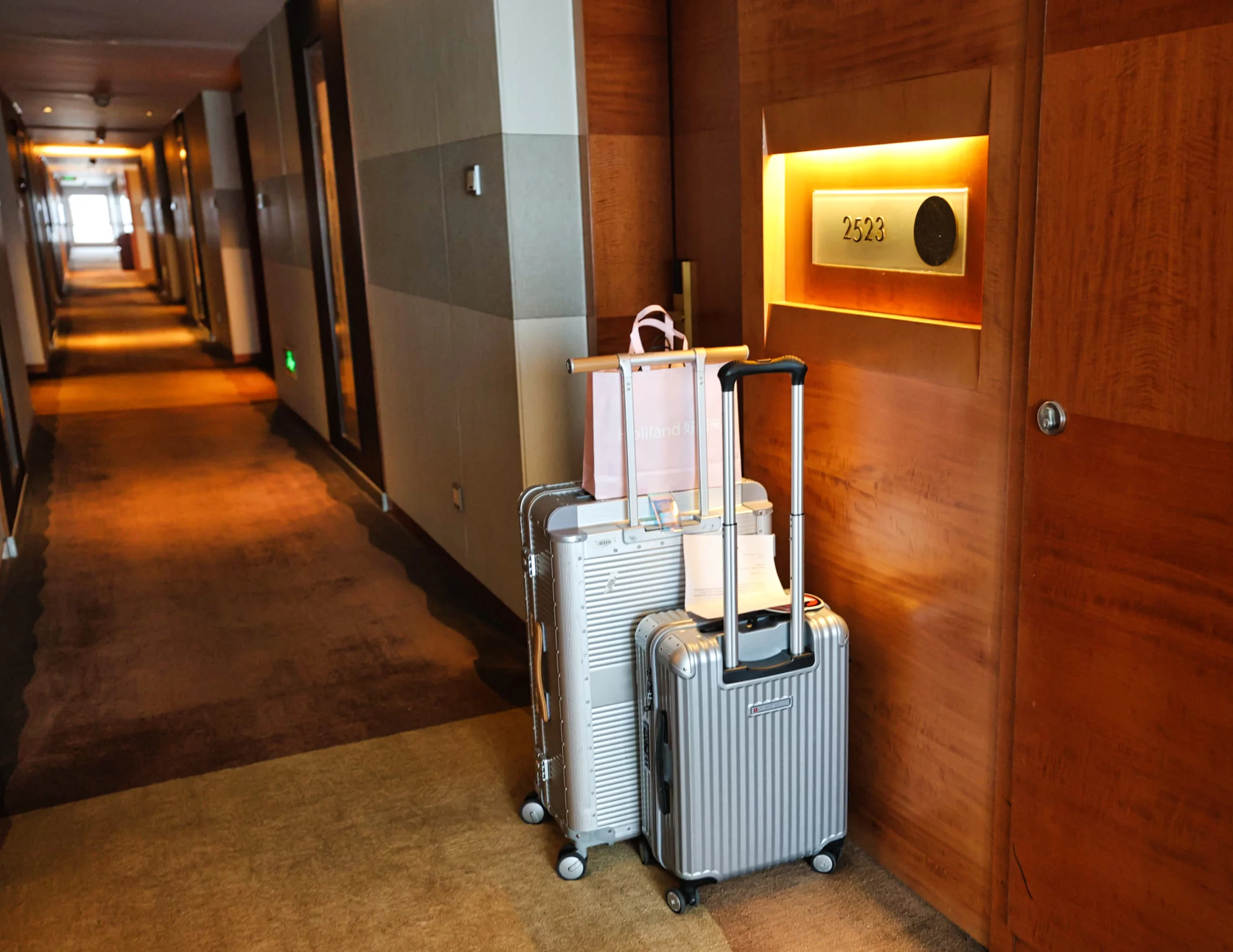 Hotel hallway with carpeted floor