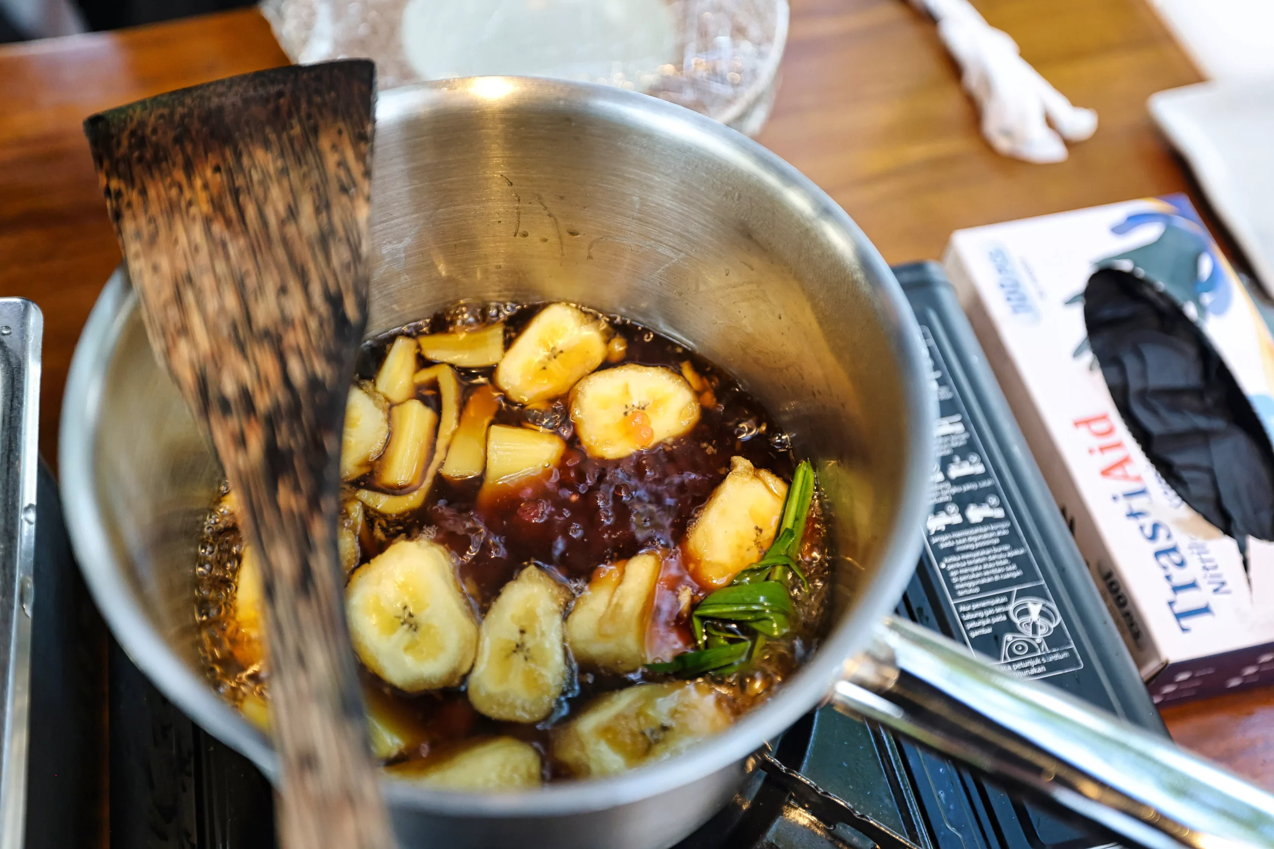 Making and tasting Kolak Pisang dessert
