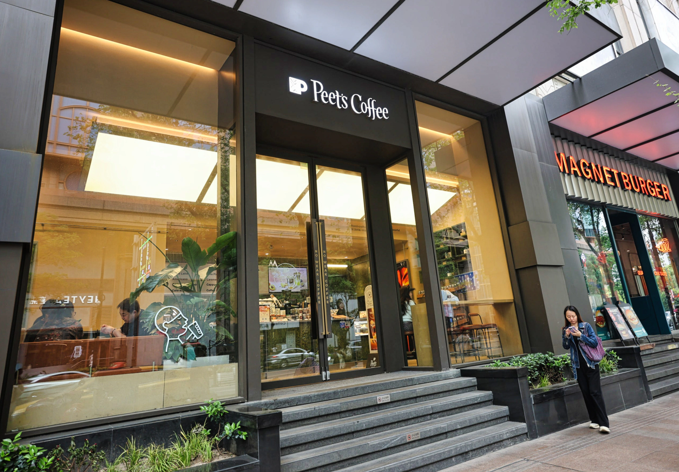 Peet's Coffee storefront sign visible in a busy area