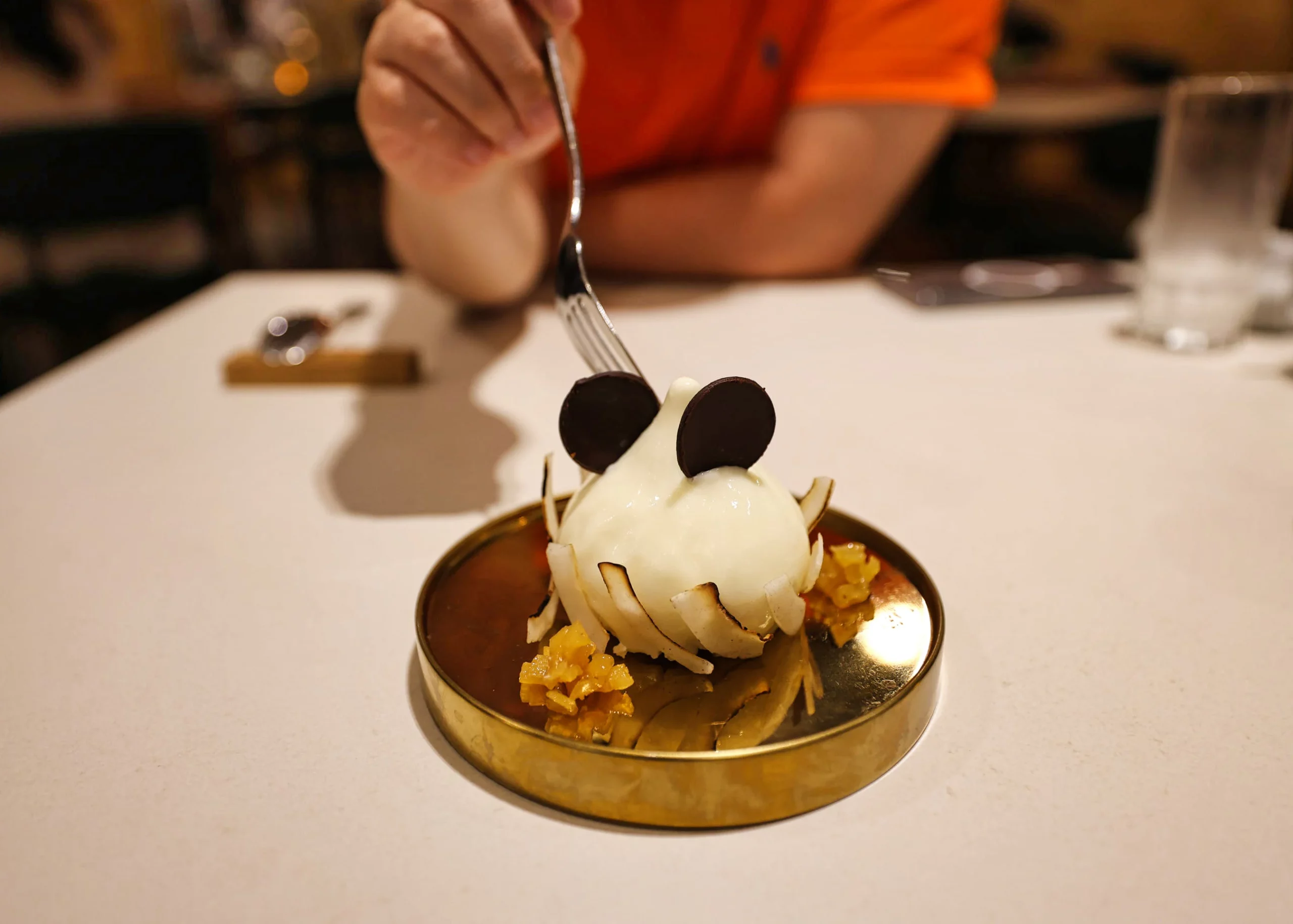 Yuzu pina colada cheesecake with dry ice fog