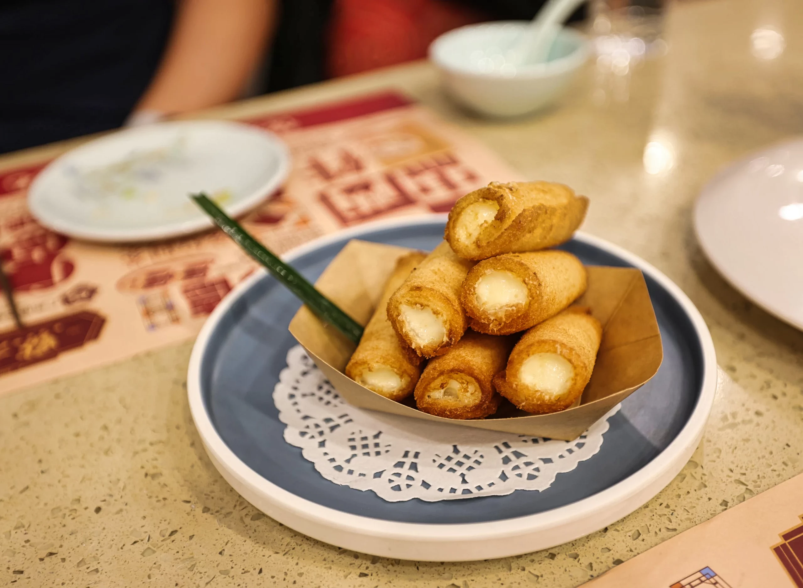 Crispy fried milk roll dessert presentation