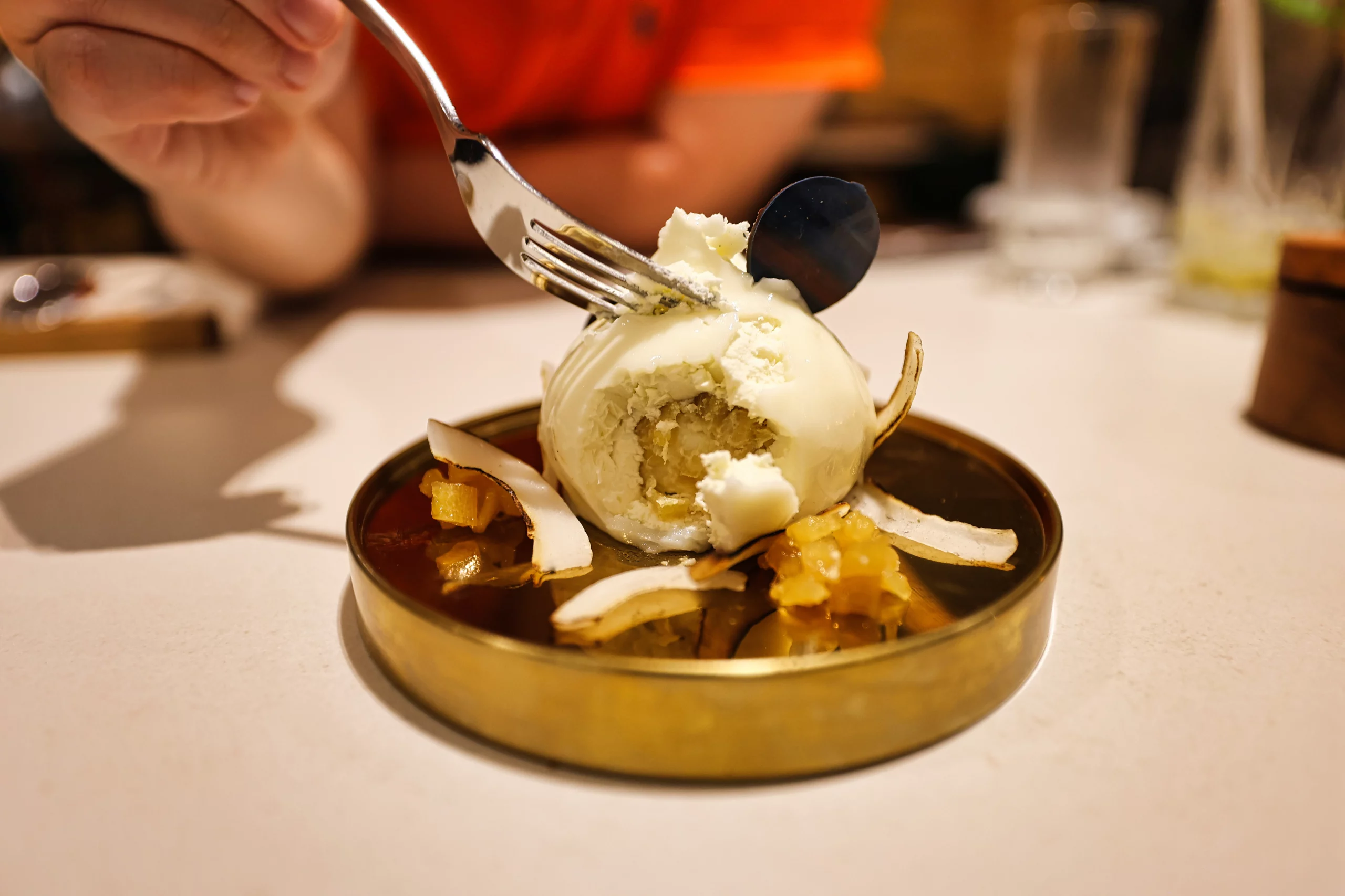Yuzu pina colada cheesecake with dry ice fog