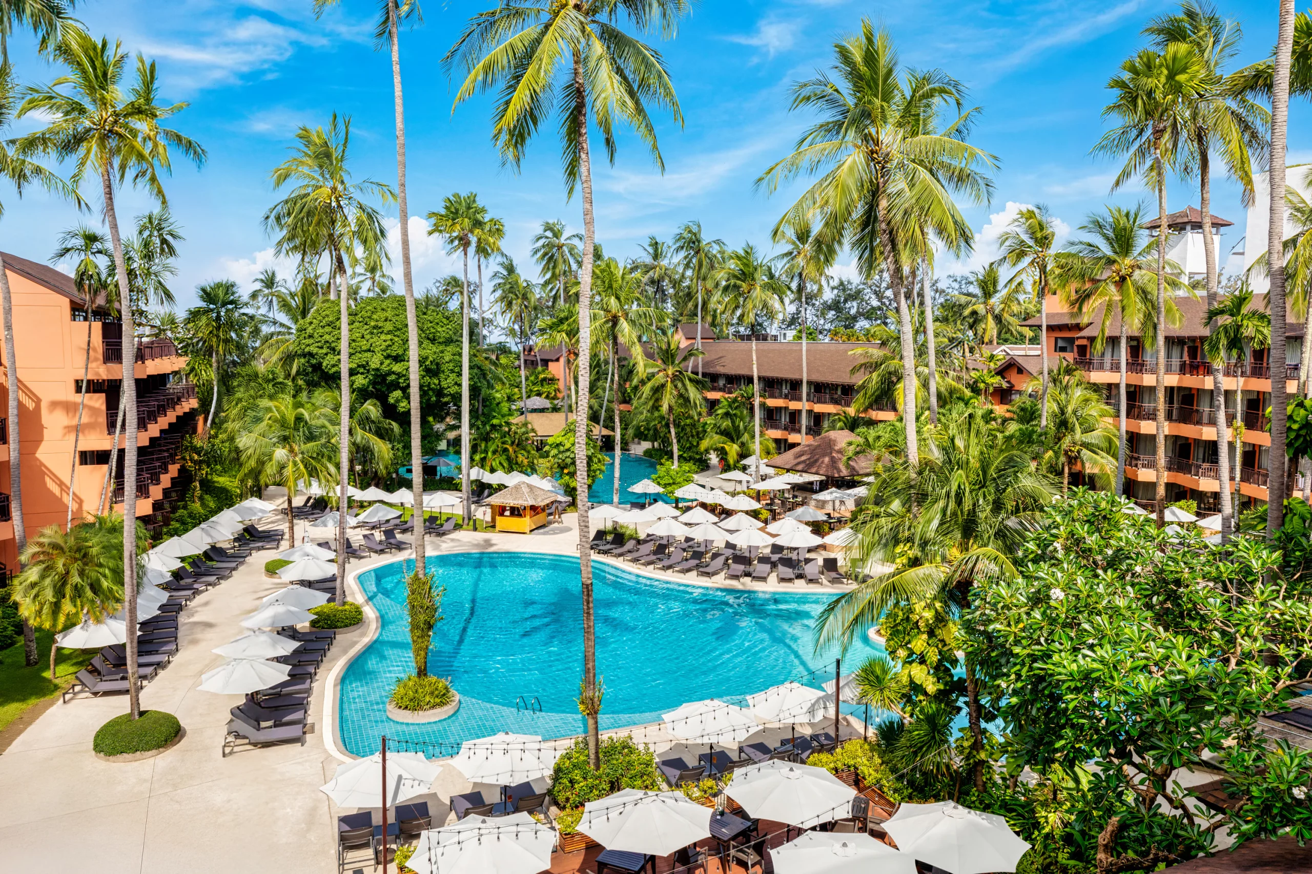 Wide shot of multiple swimming pools at the resort