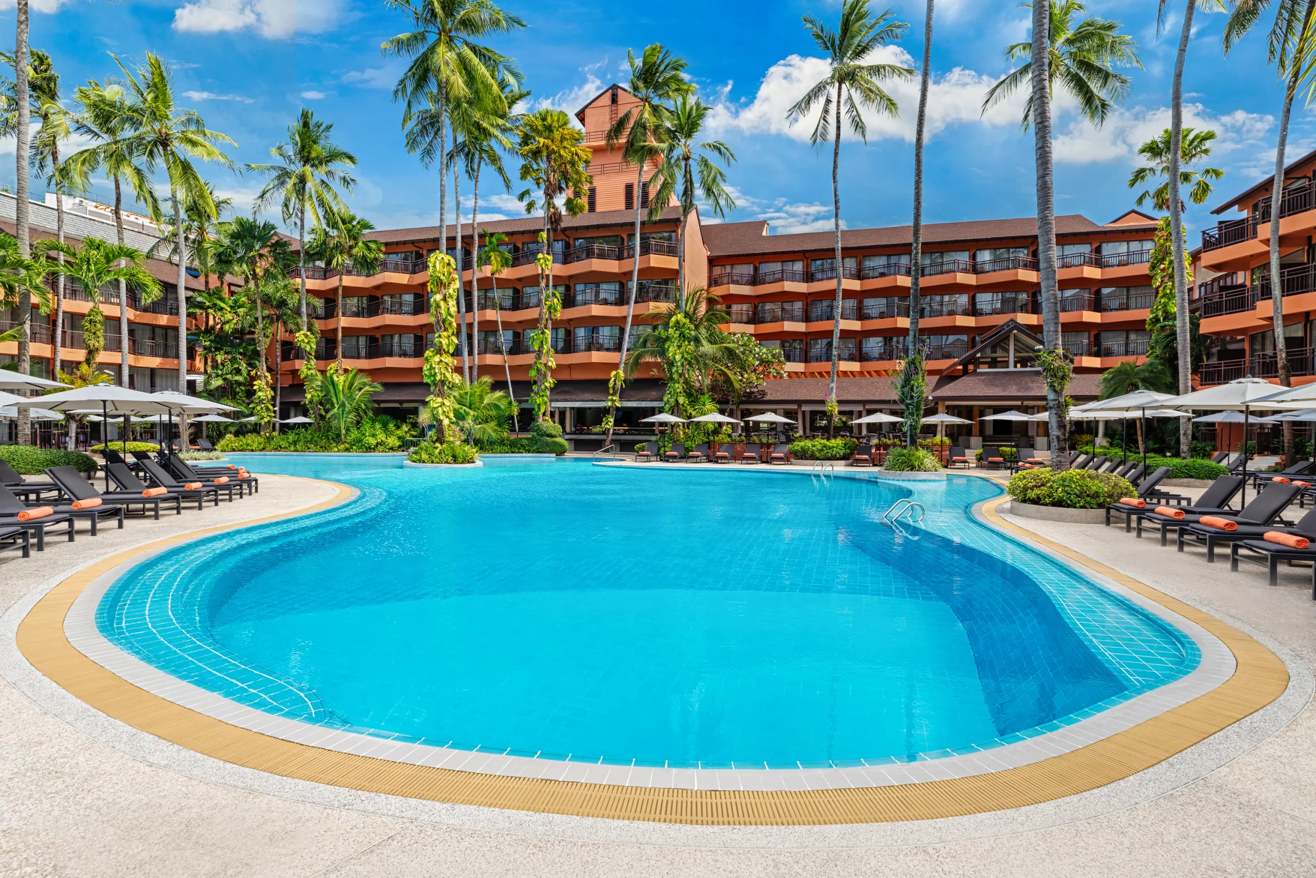 Wide shot of multiple swimming pools at the resort