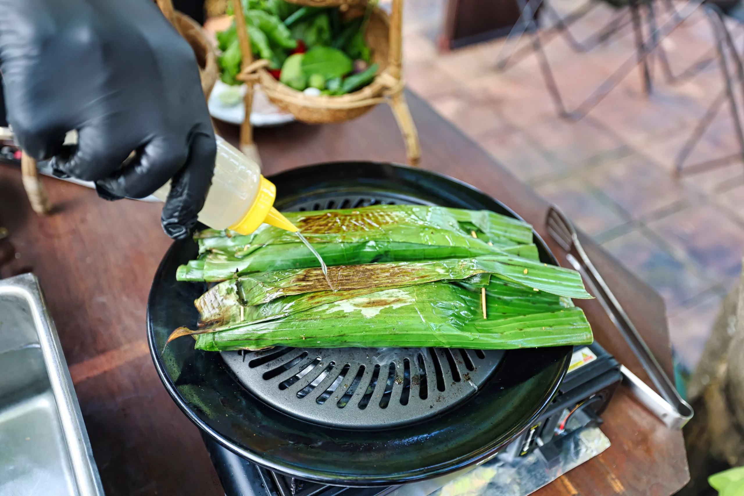 Cooking Pepes Ikan with banana leaves