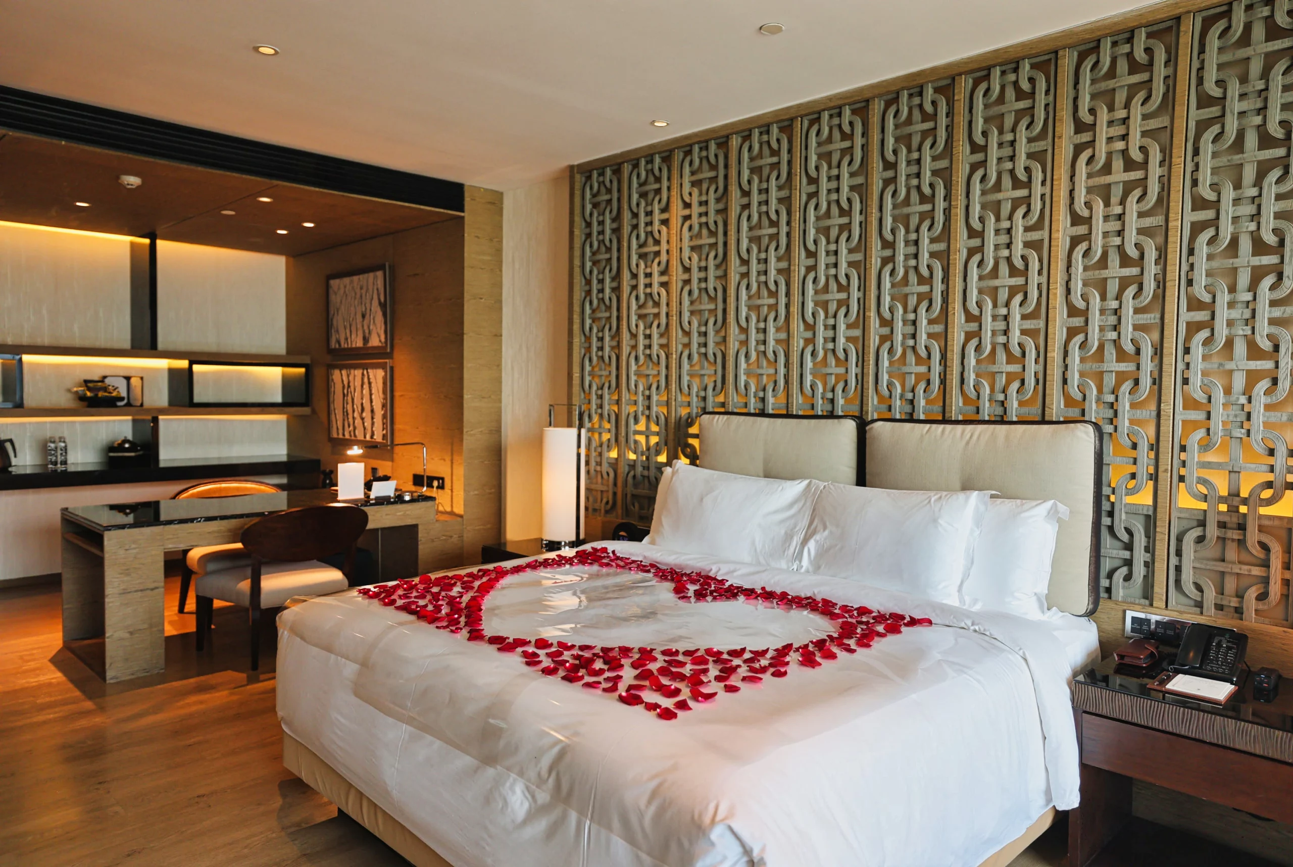 Spacious King bed and sofa setup in hotel room