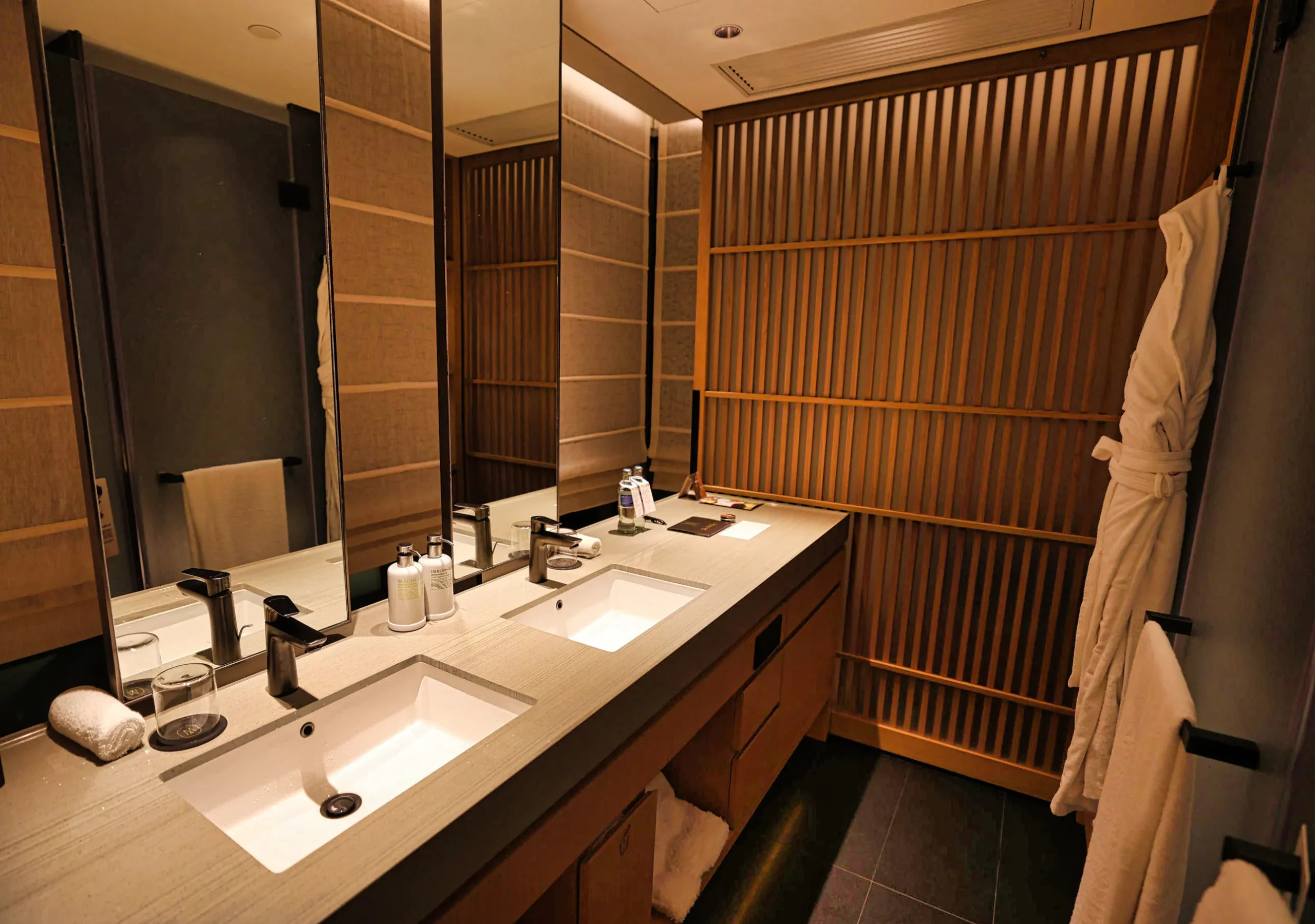 Bathroom with double sinks at AKI Hong Kong