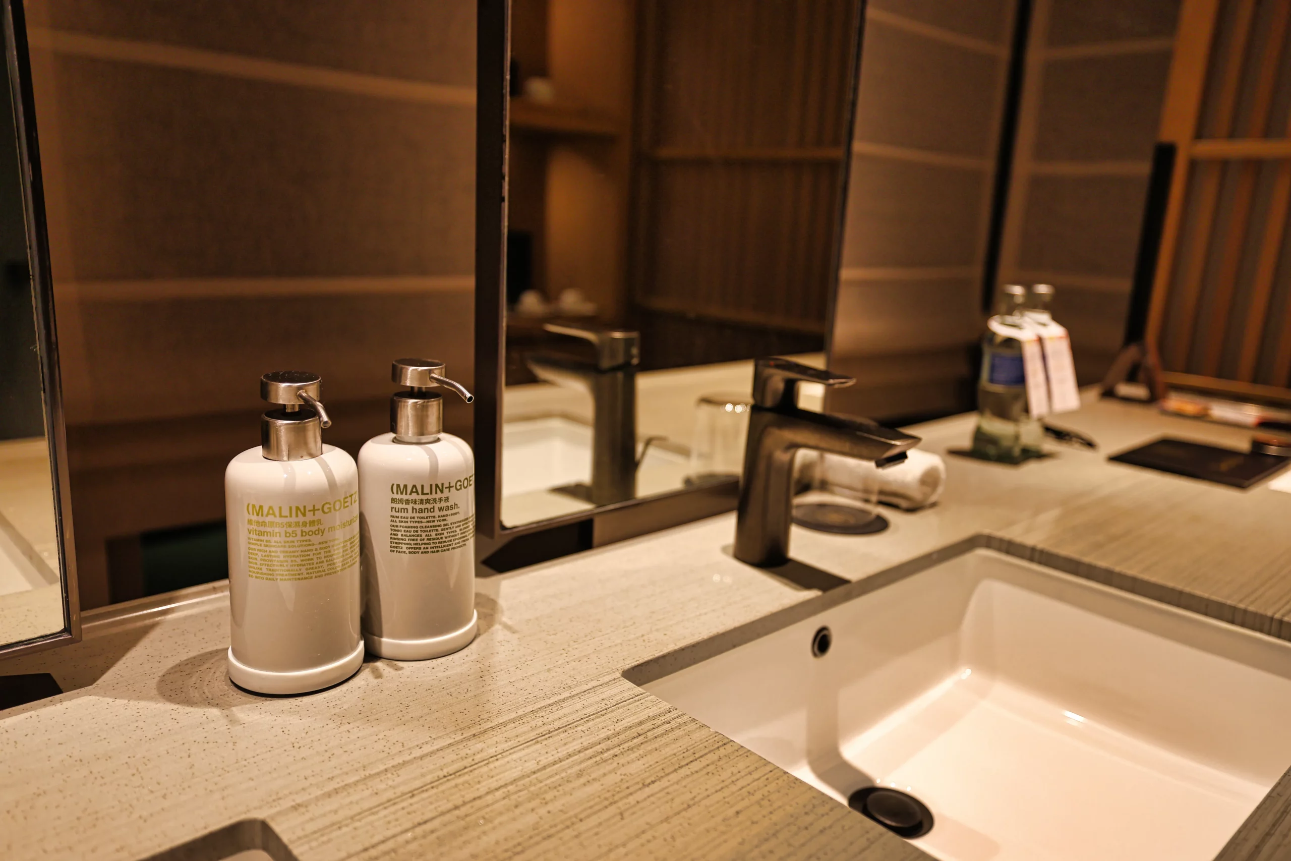 Bathroom with double sinks at AKI Hong Kong
