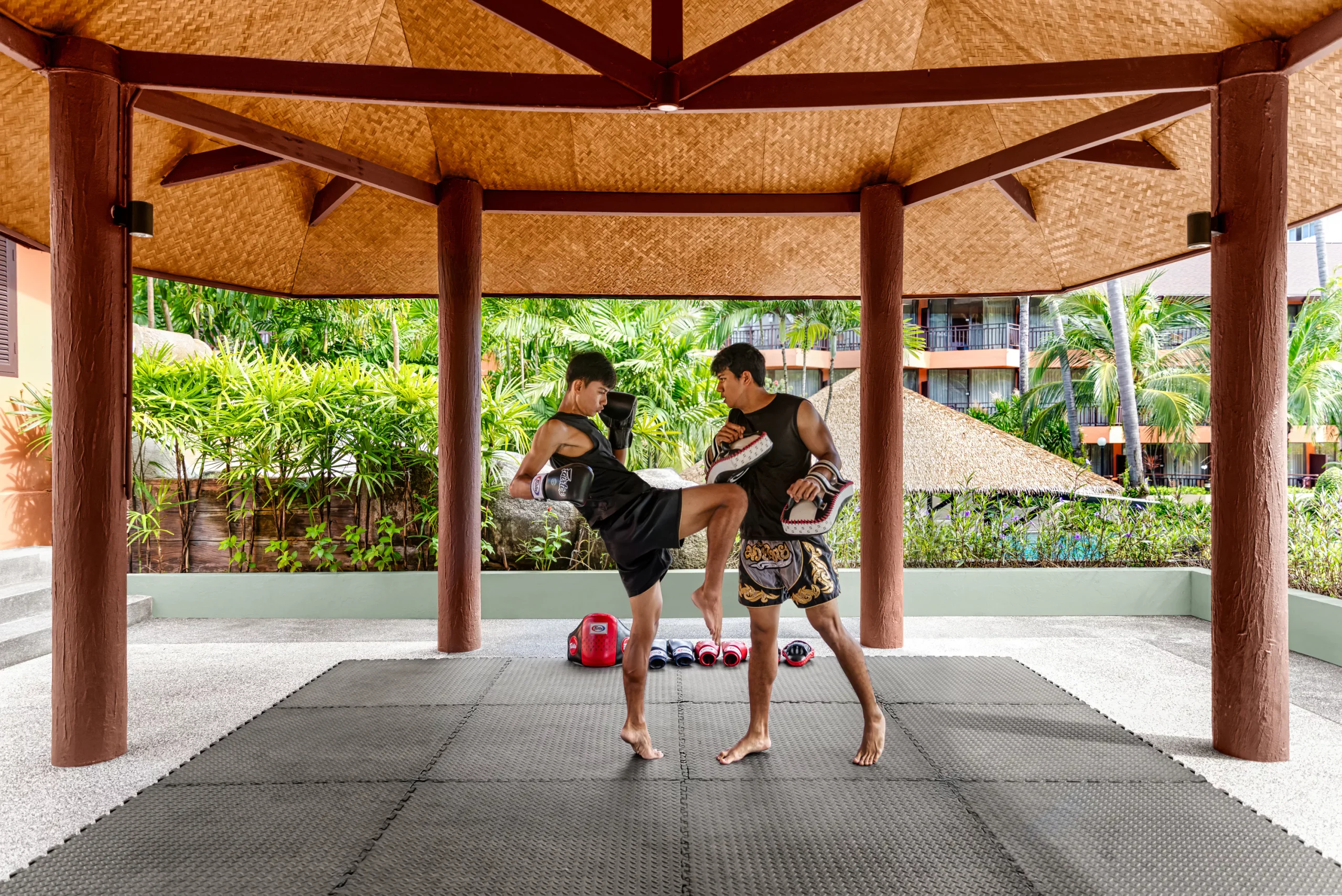 Guests participating in a Muay Thai or Yoga class