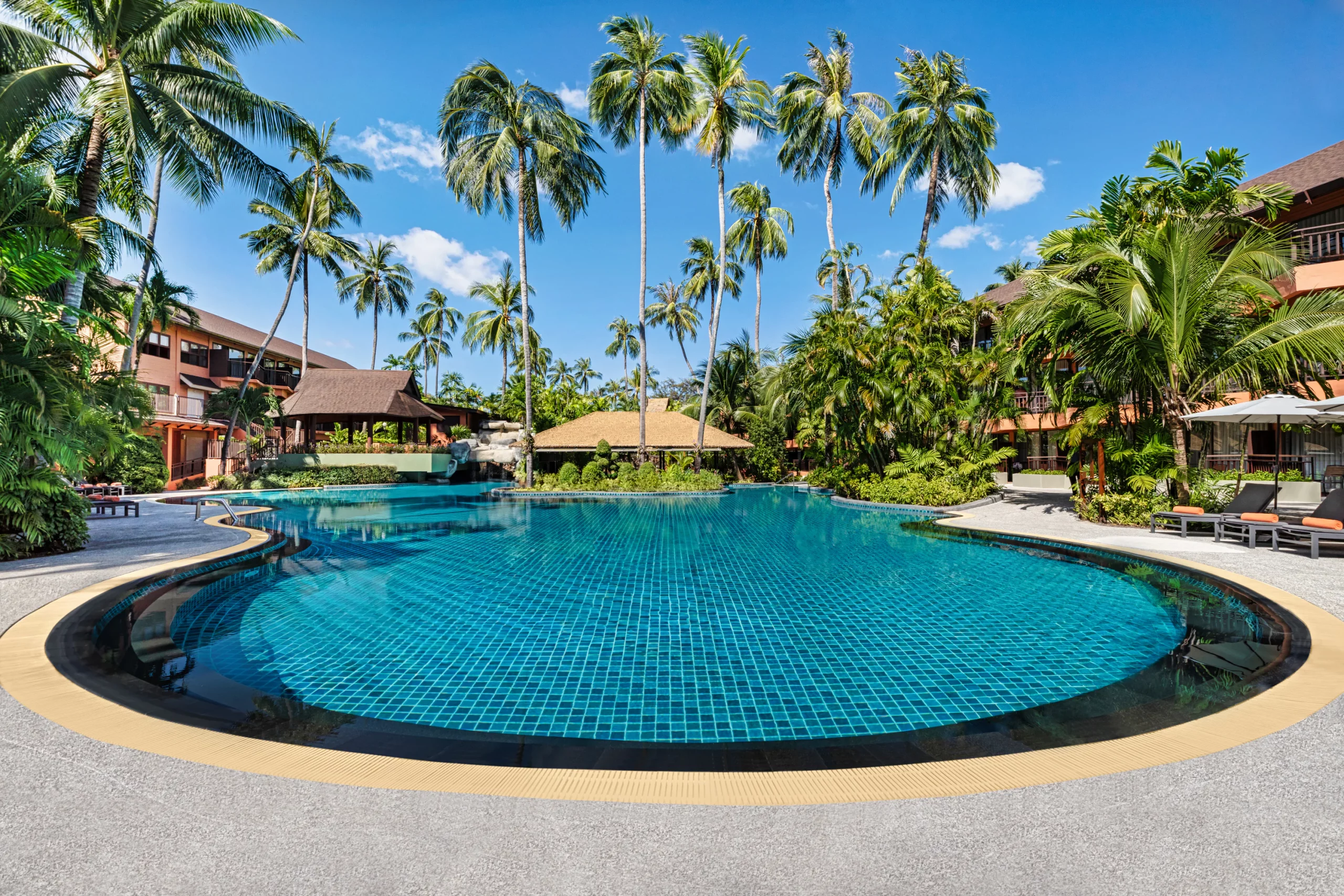 Wide shot of multiple swimming pools at the resort