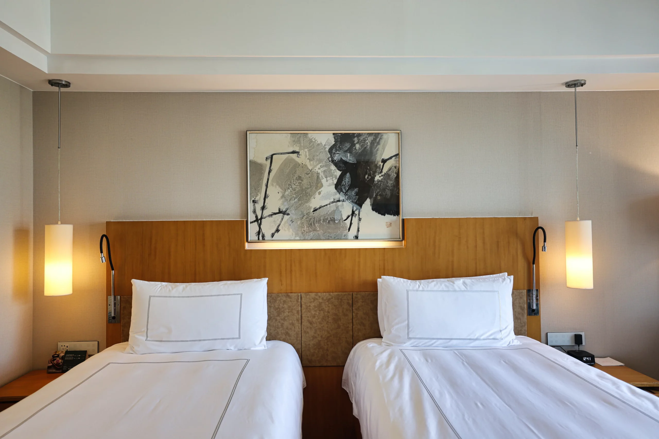 Comfortable bed with soft lighting in a hotel room 