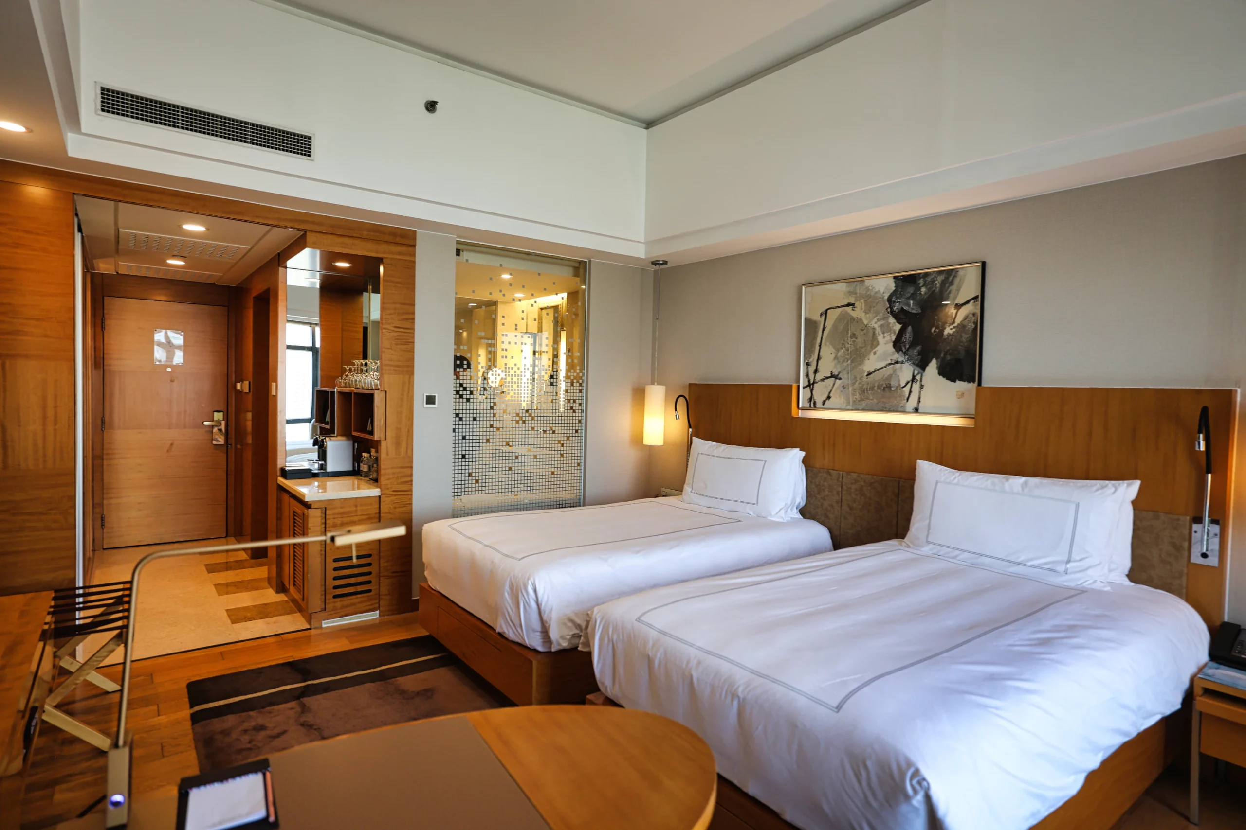 Comfortable bed with soft lighting in a hotel room 