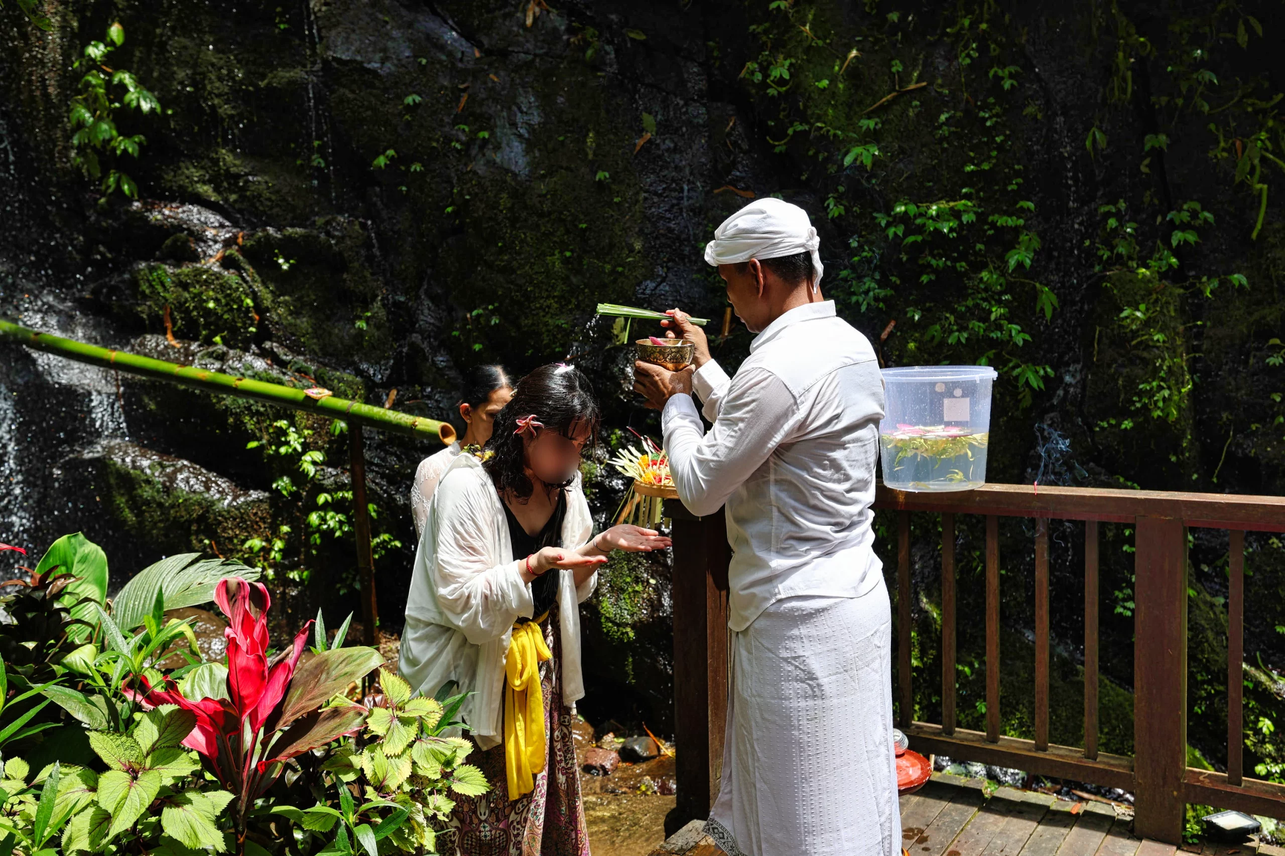Receiving blessing with flower water