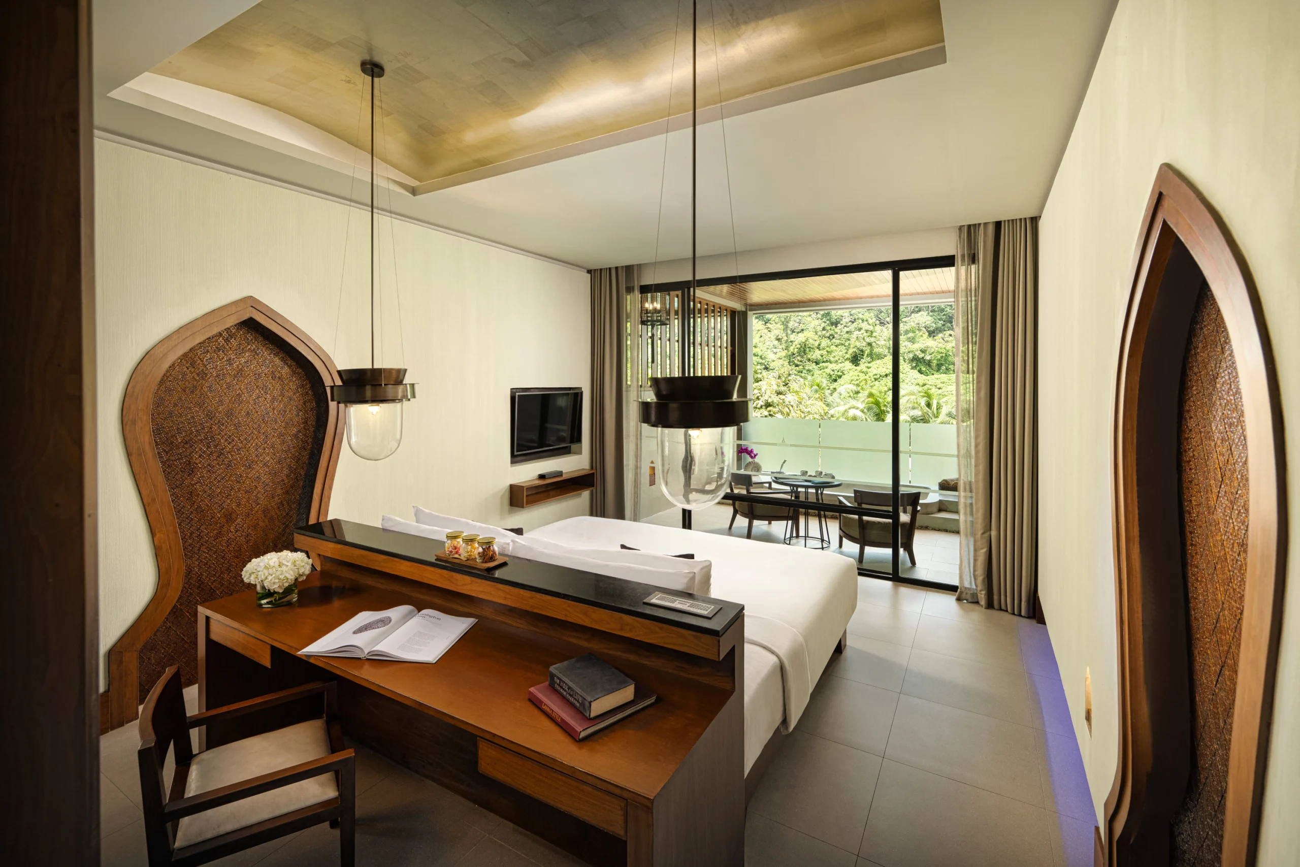 Spacious hotel room interior with Thai decor