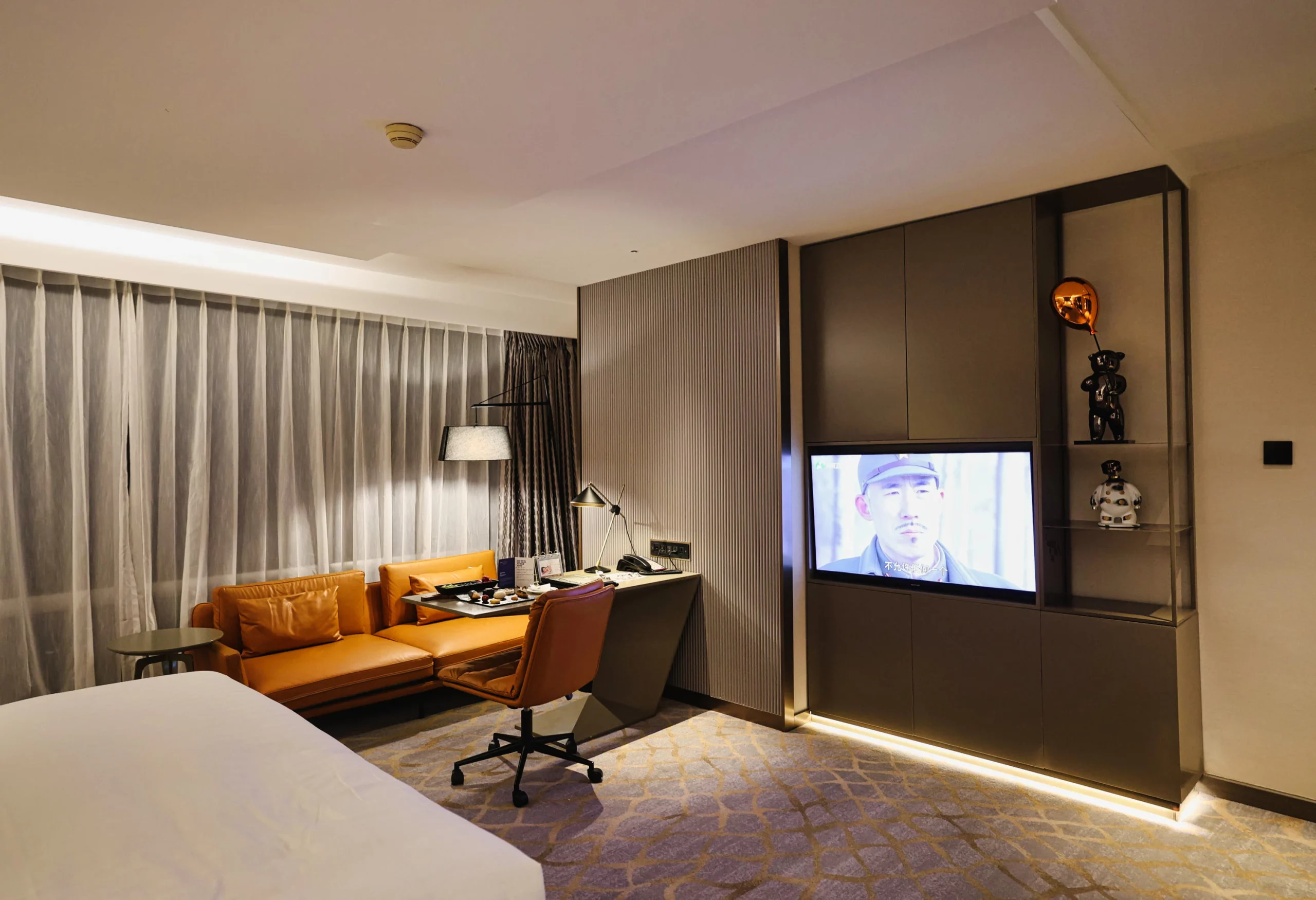 The layout of the room showing the bed, desk, and sofa.