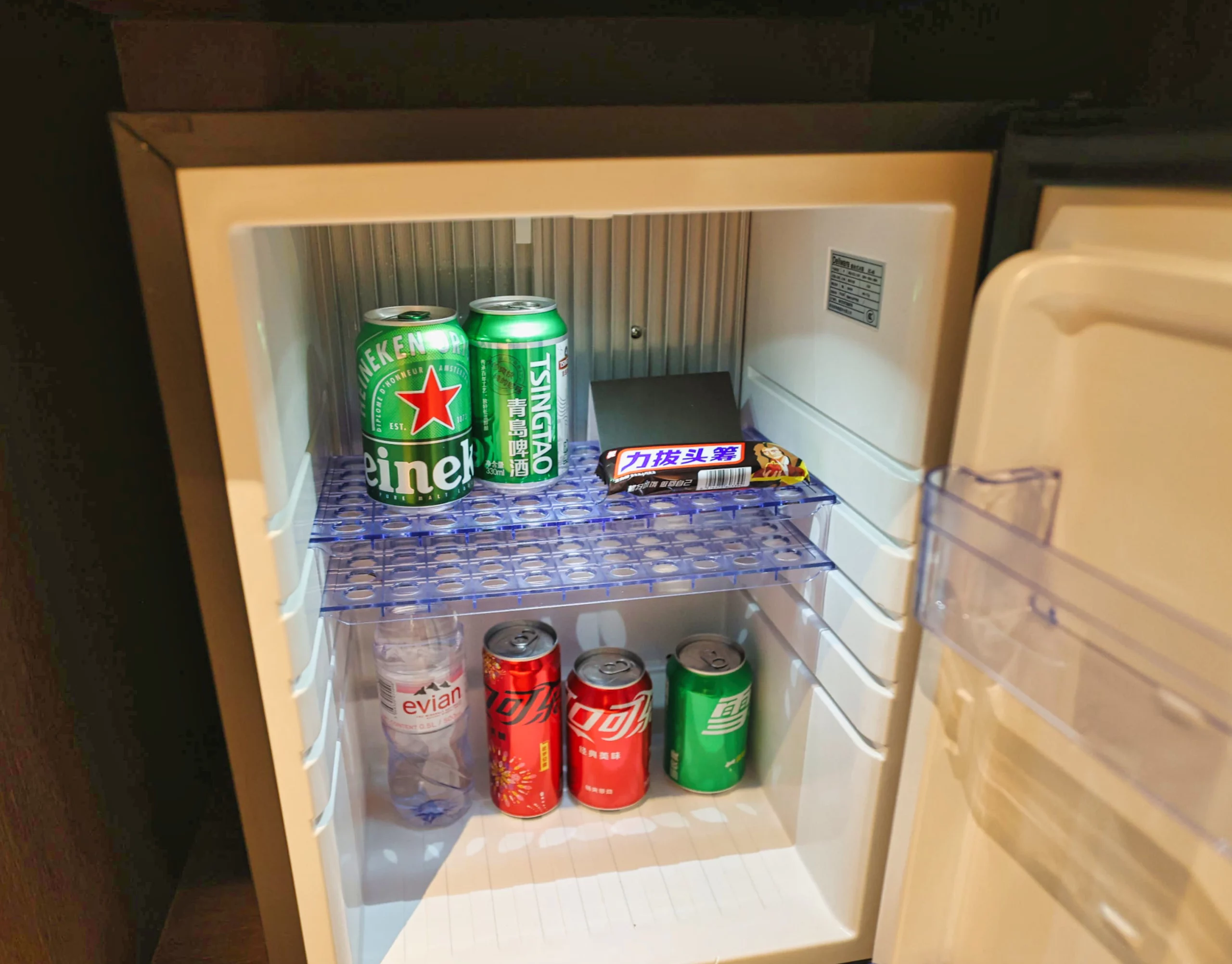 The capsule coffee machine and minibar items.