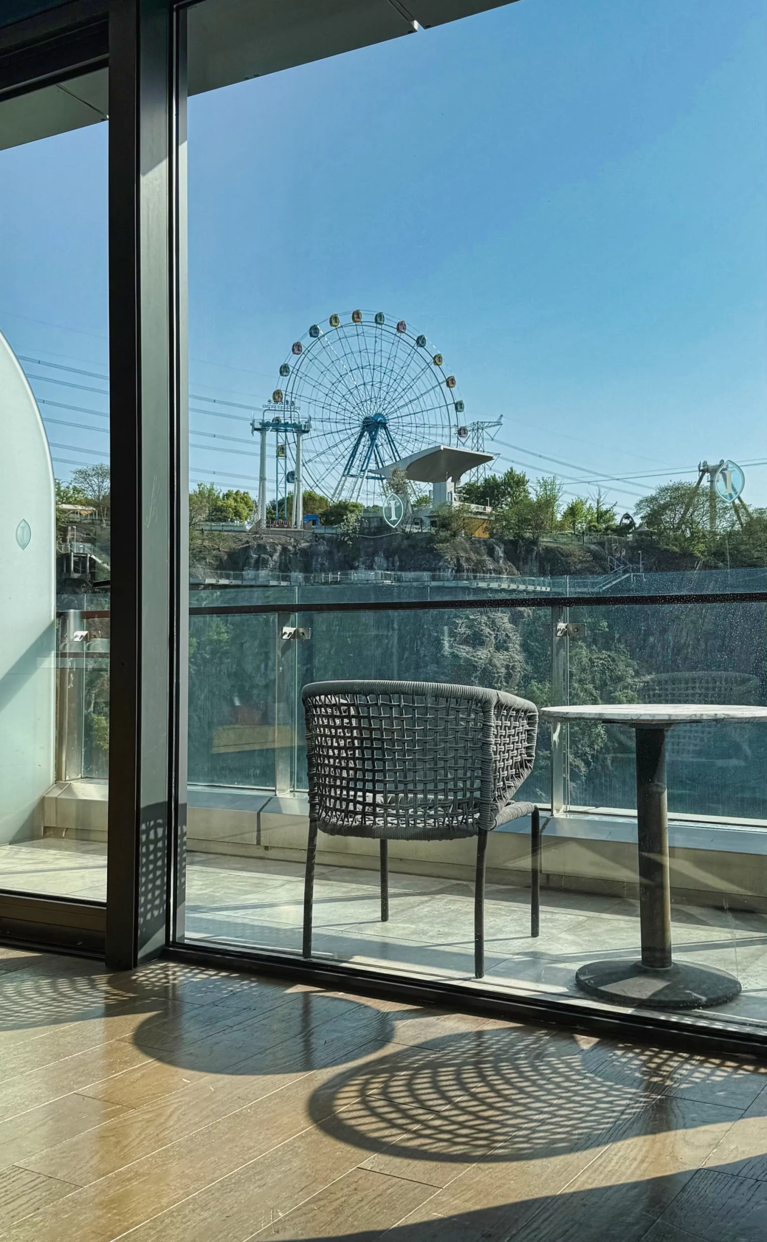 Relaxing outdoor seating area on a hotel room balcony.